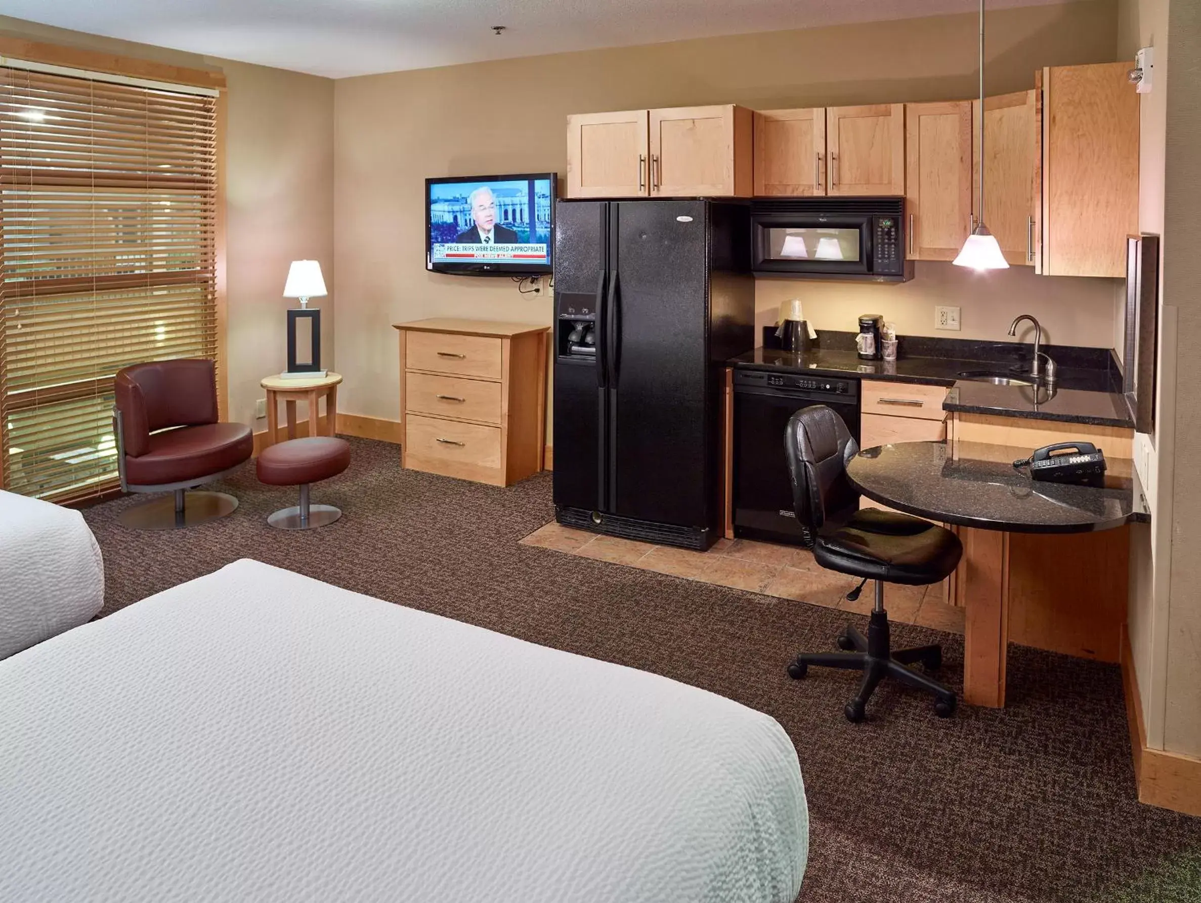 Photo of the whole room, TV/Entertainment Center in LivINN Hotel Minneapolis North / Fridley