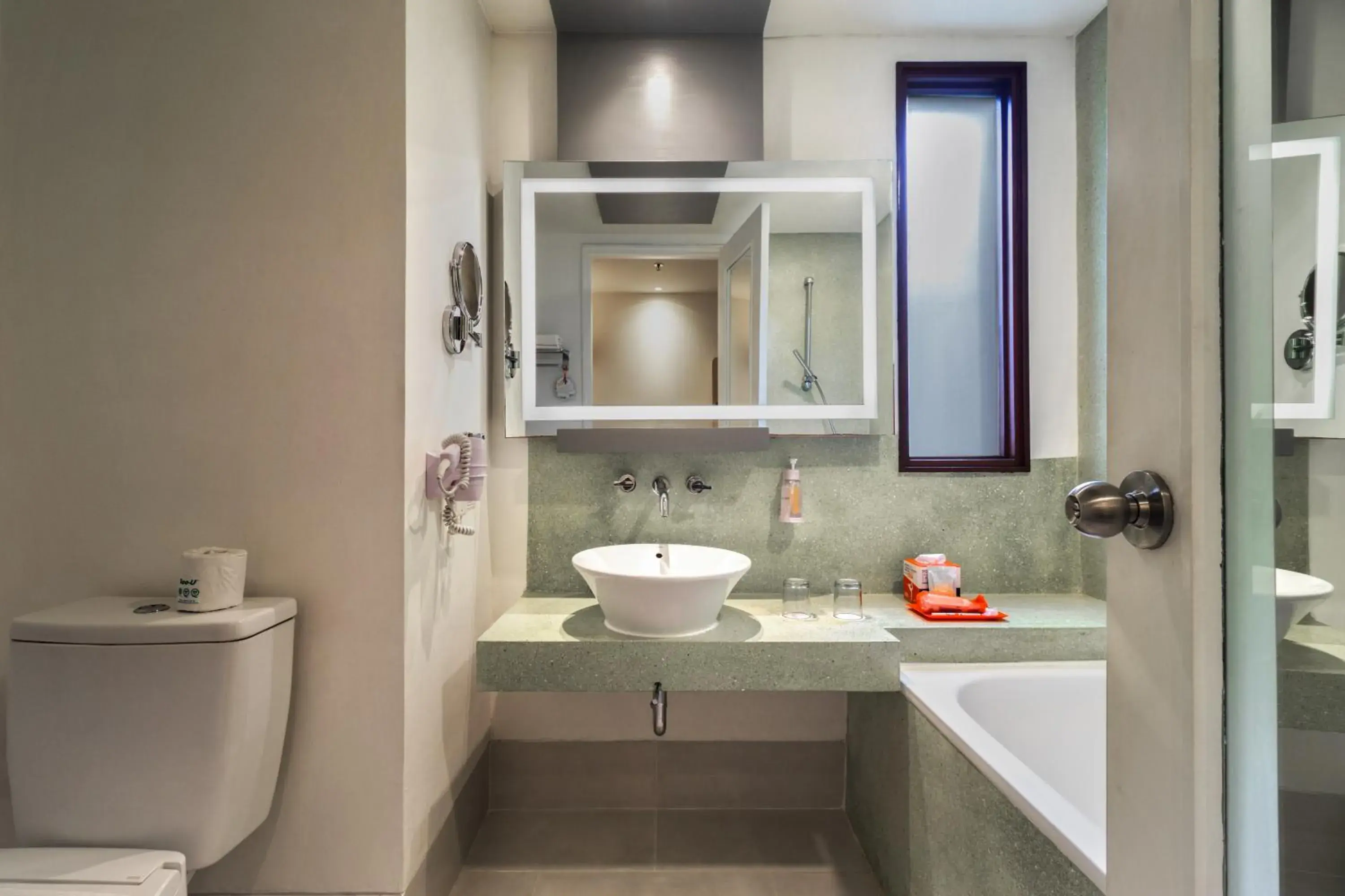 Bathroom in HARRIS Hotel Kuta Tuban Bali