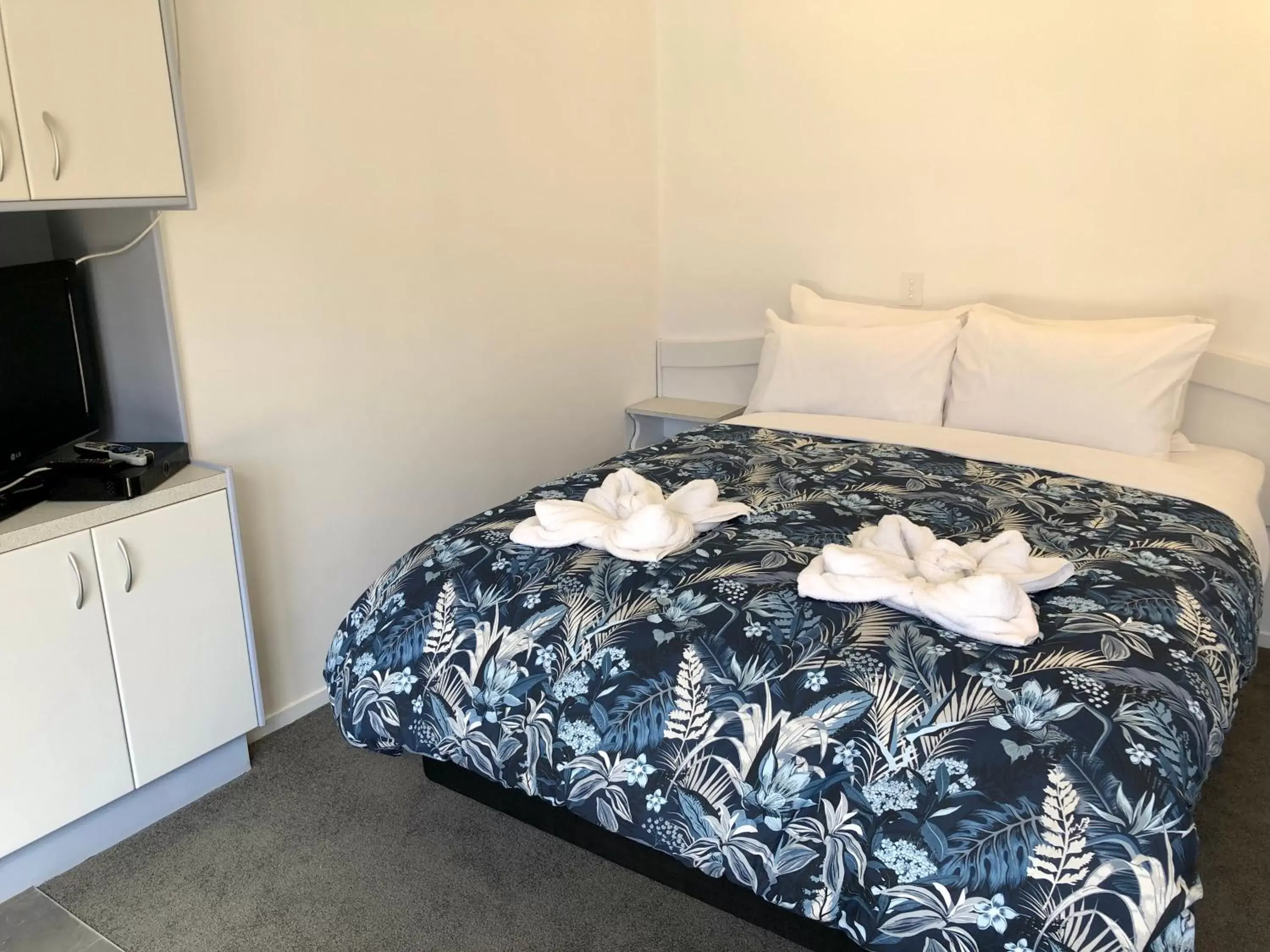 towels, Bed in PURE Motel & Pure Guest House