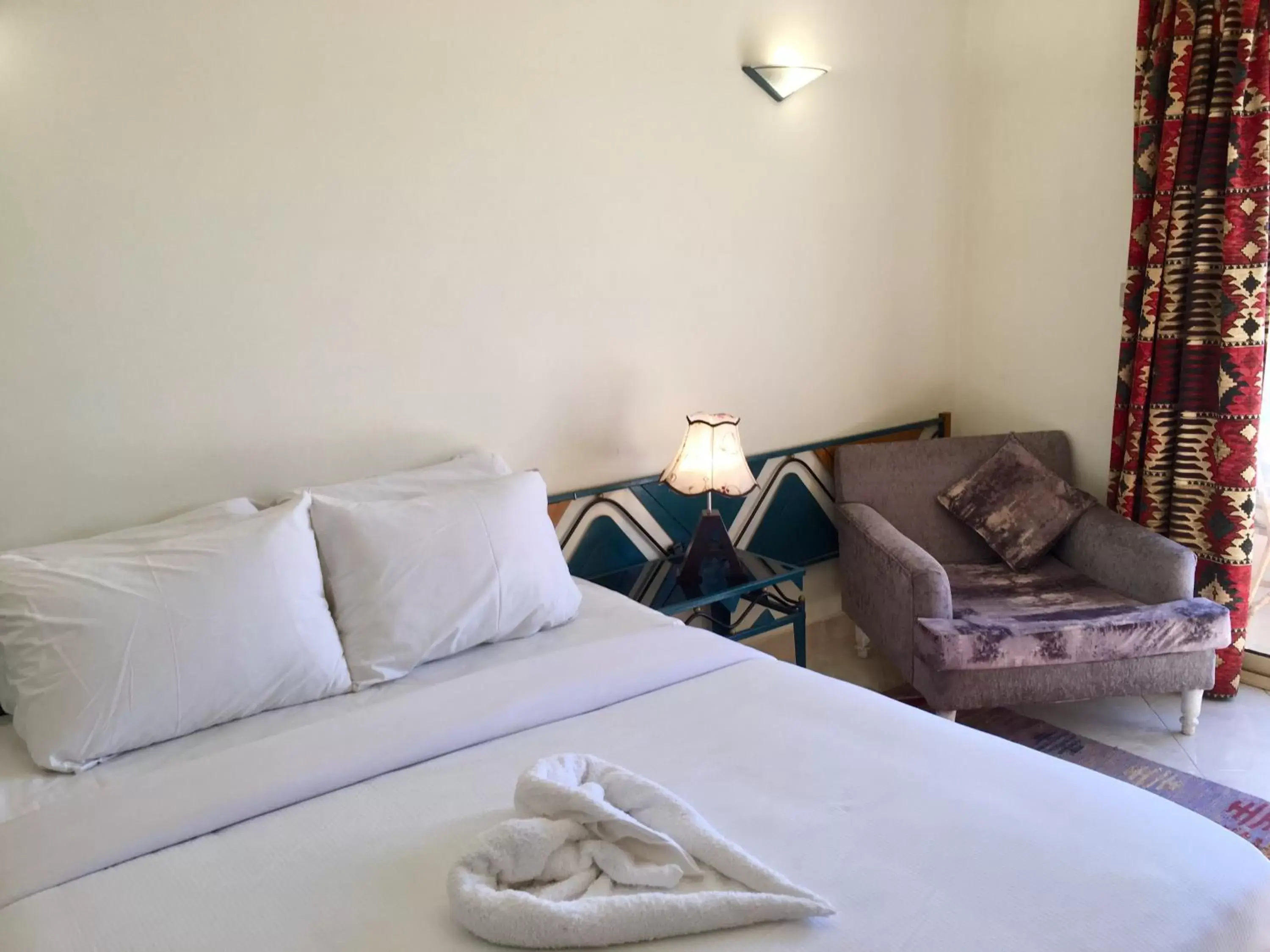 Bed in New Memnon Hotel