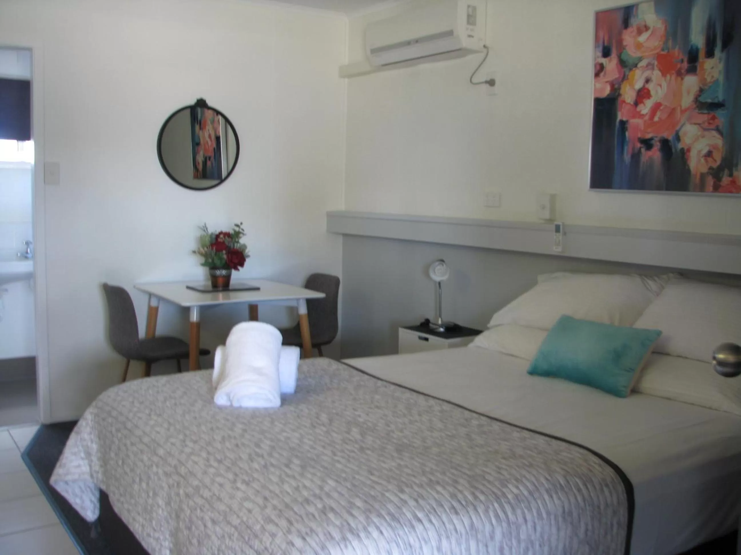 Bed in Charm City Motel