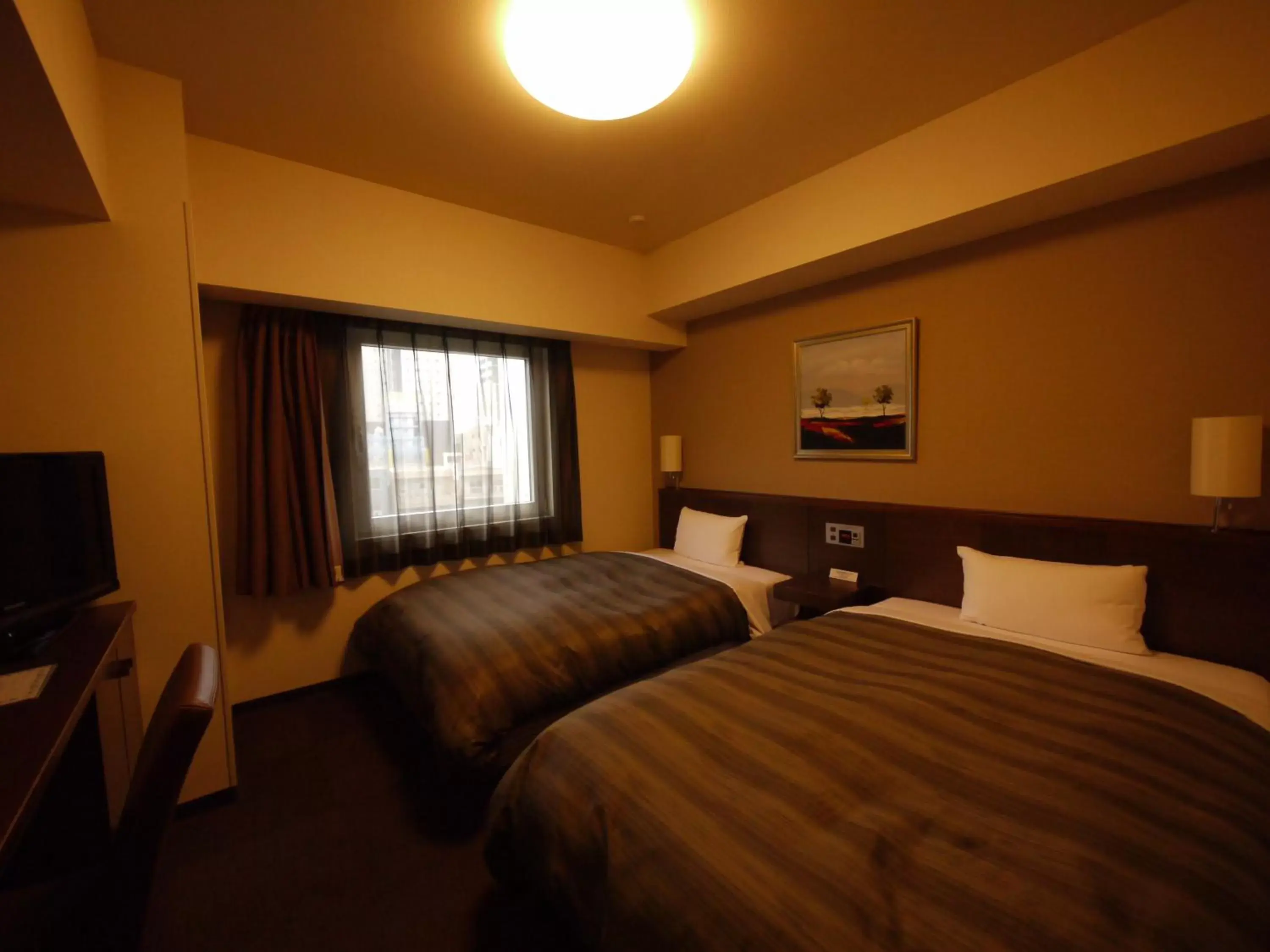 Photo of the whole room, Bed in Hotel Route-Inn Nagoya Imaike Ekimae