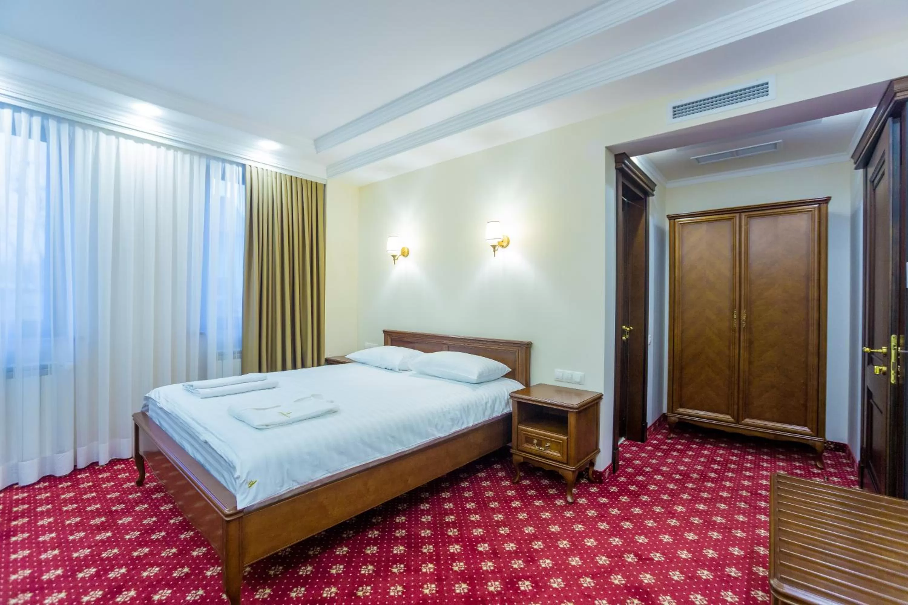 Photo of the whole room, Bed in Ambassador Hotel