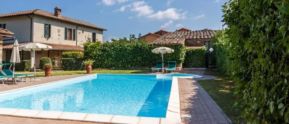 Pool view, Property Building in Le Volpaie