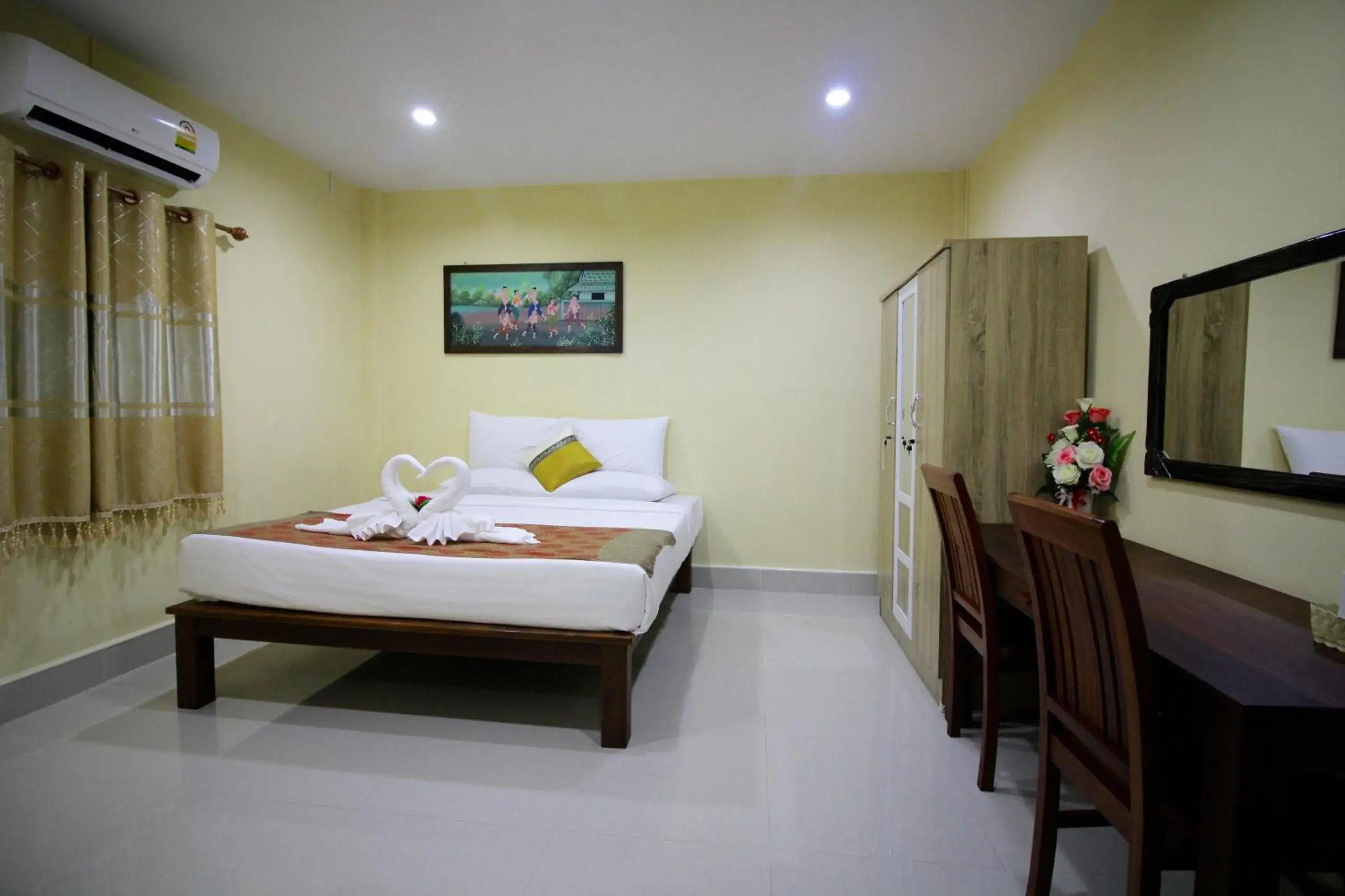 Bed in Srisiam Resort