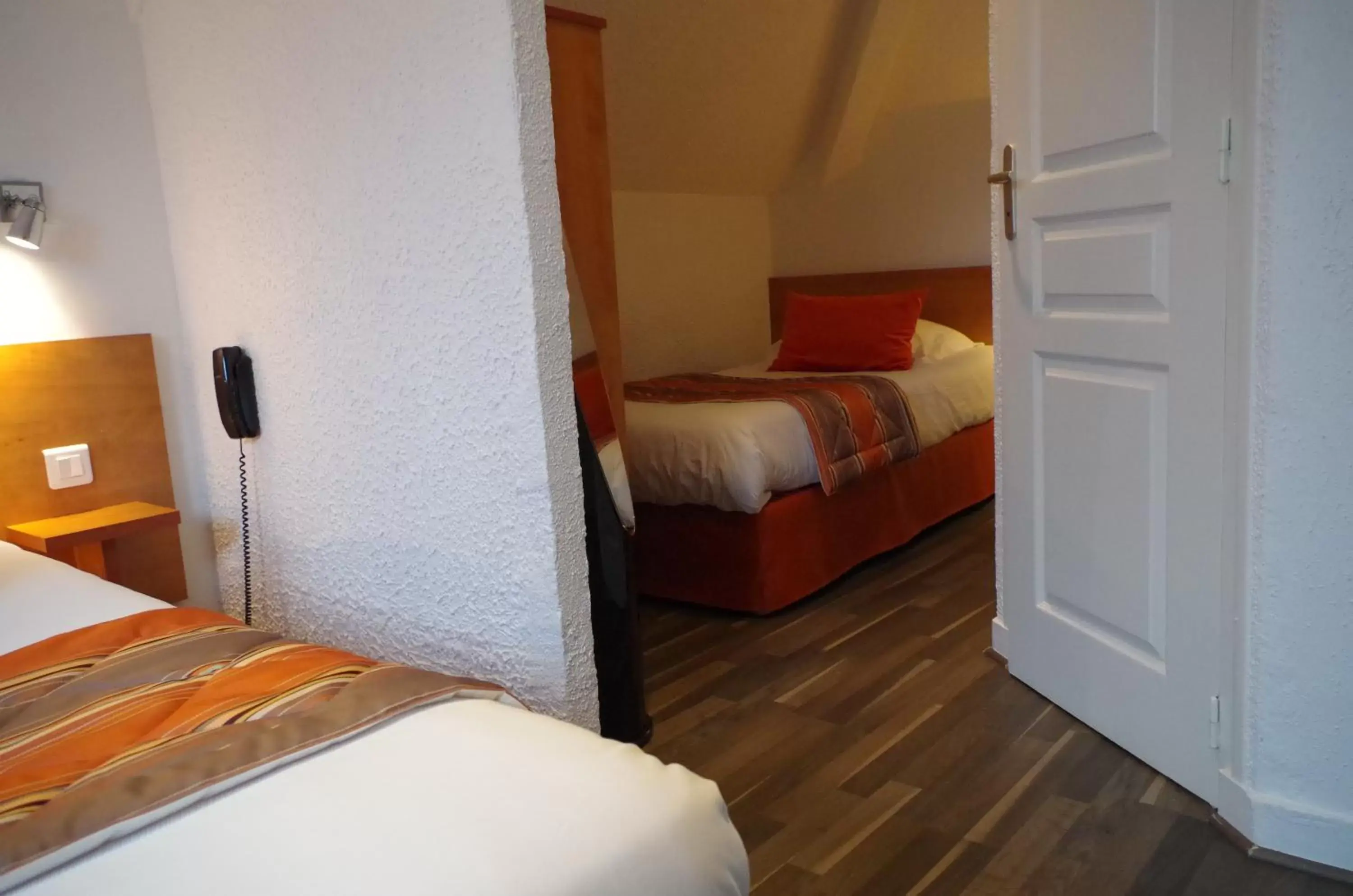 Bed in Logis Hotel Beaudon