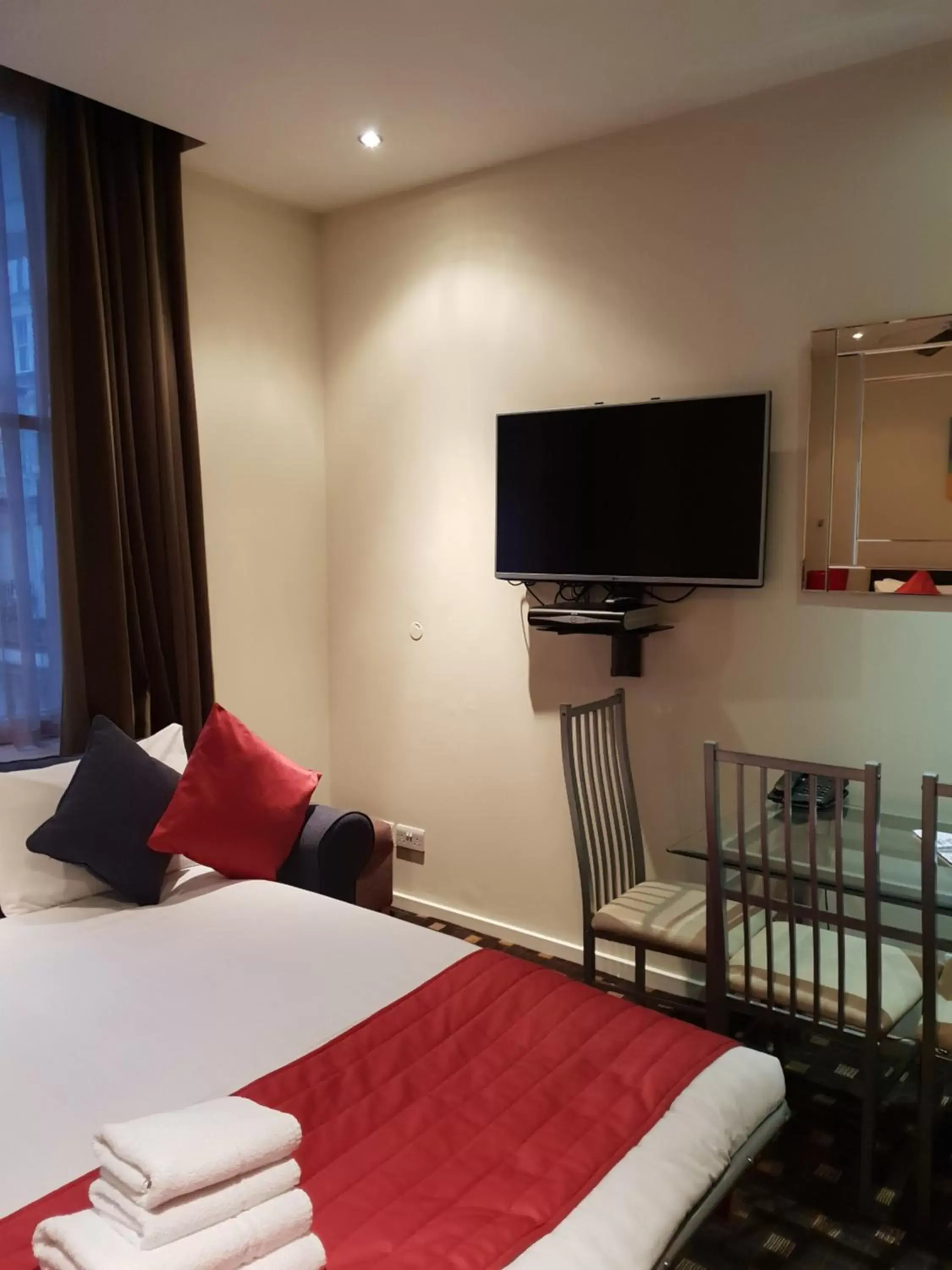 Seating area, Bed in Grand Plaza Serviced Apartments