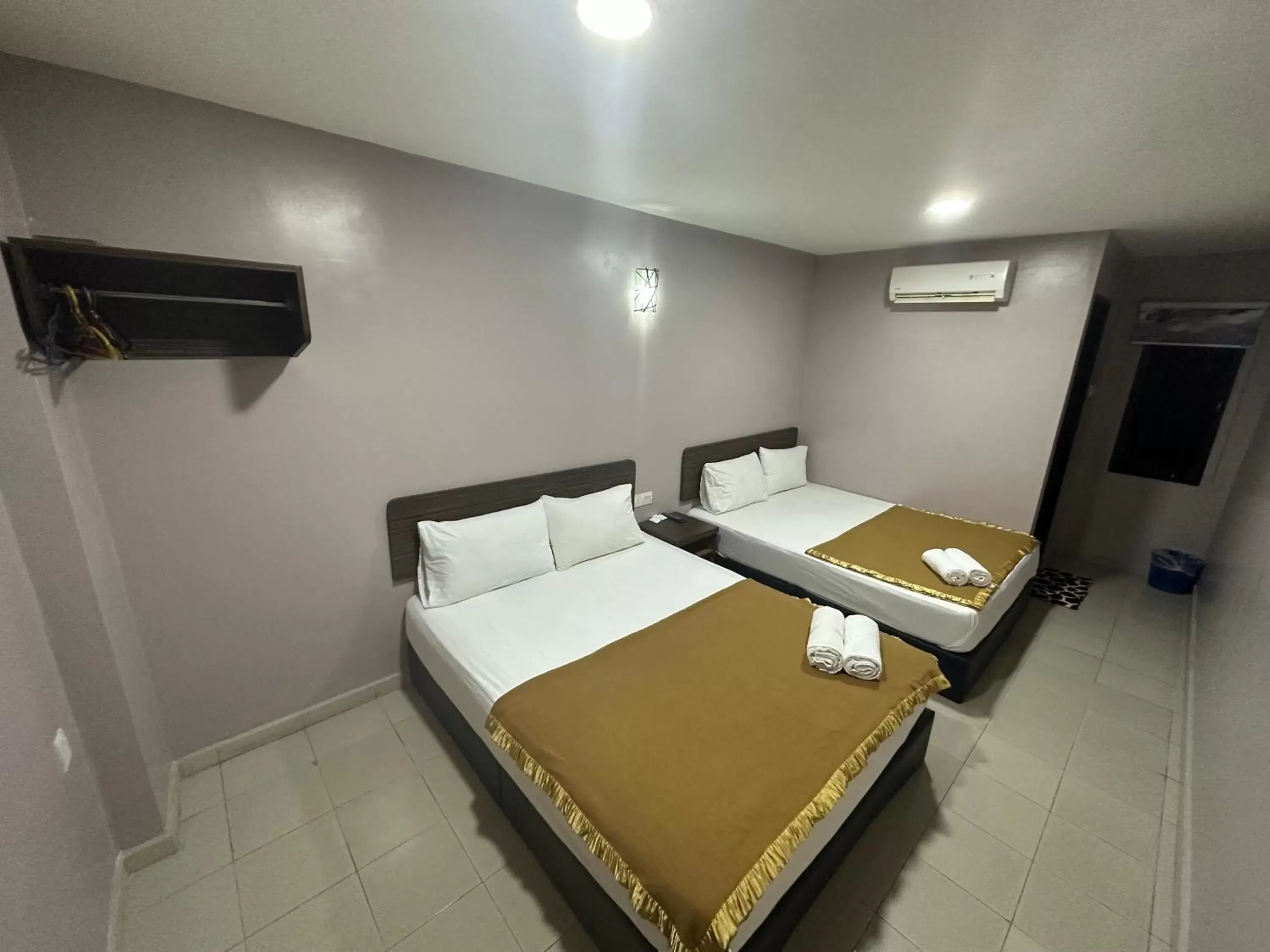 Bed in ISLAND TIME MOTEL KUAH