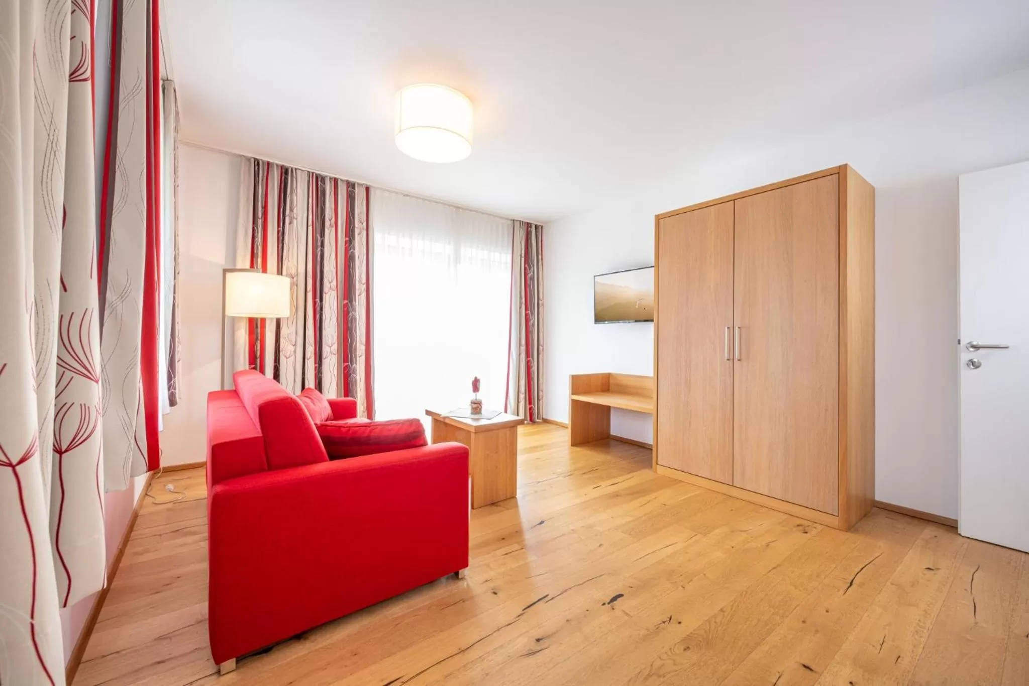 Living room, Bed in Hotel Loy