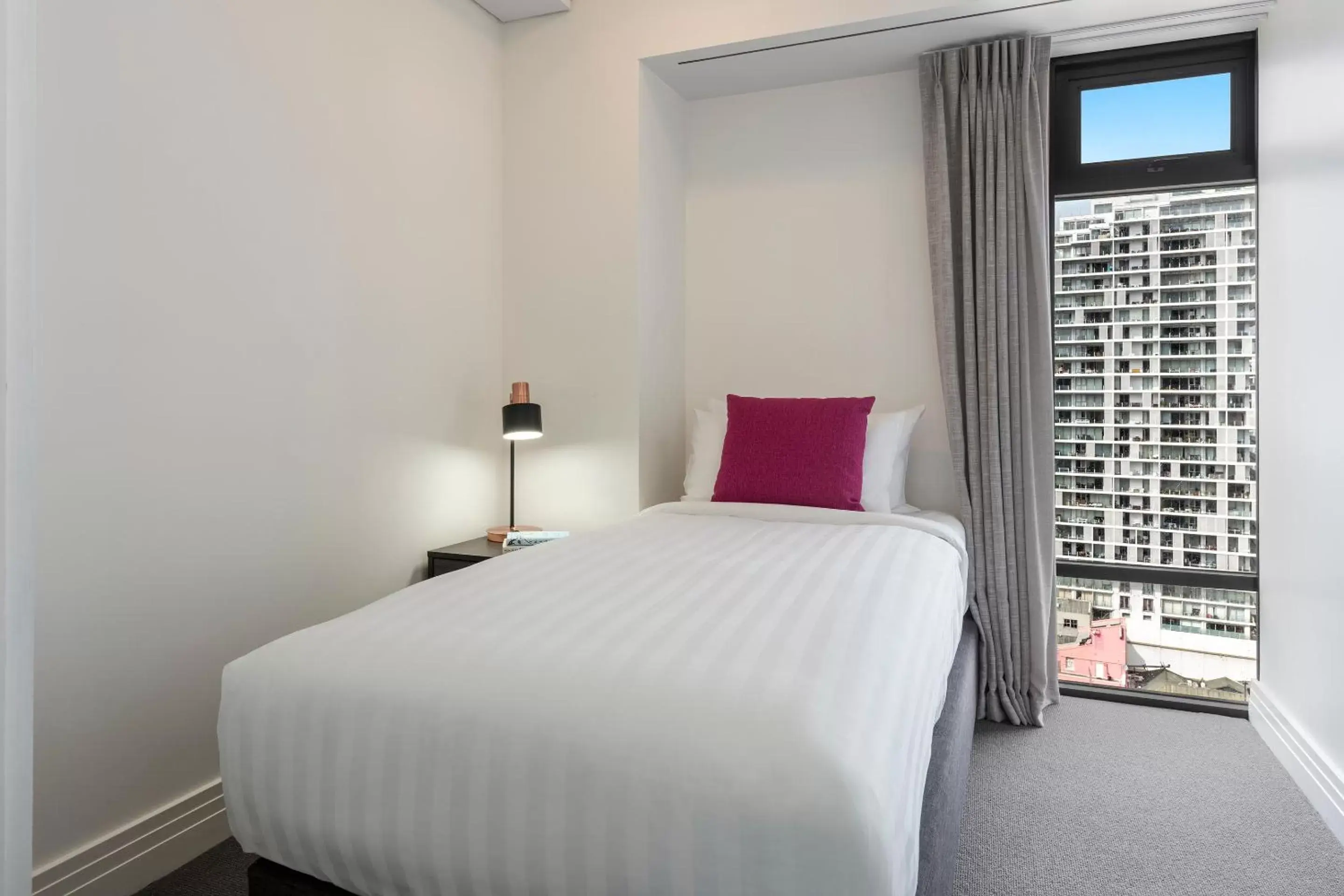 Bed in Avani Metropolis Auckland Residences