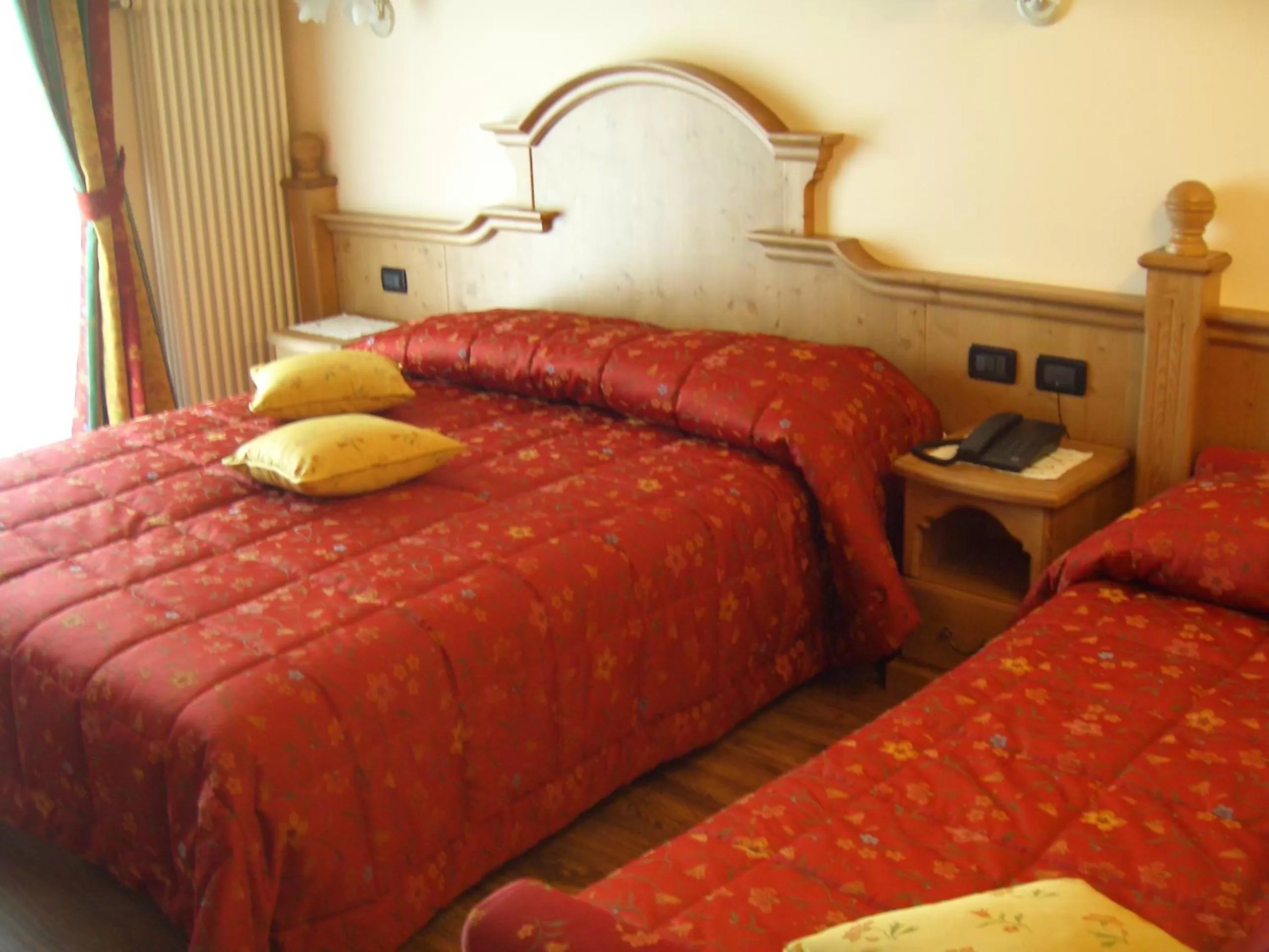 Bed in Albergo Miramonti Dependance