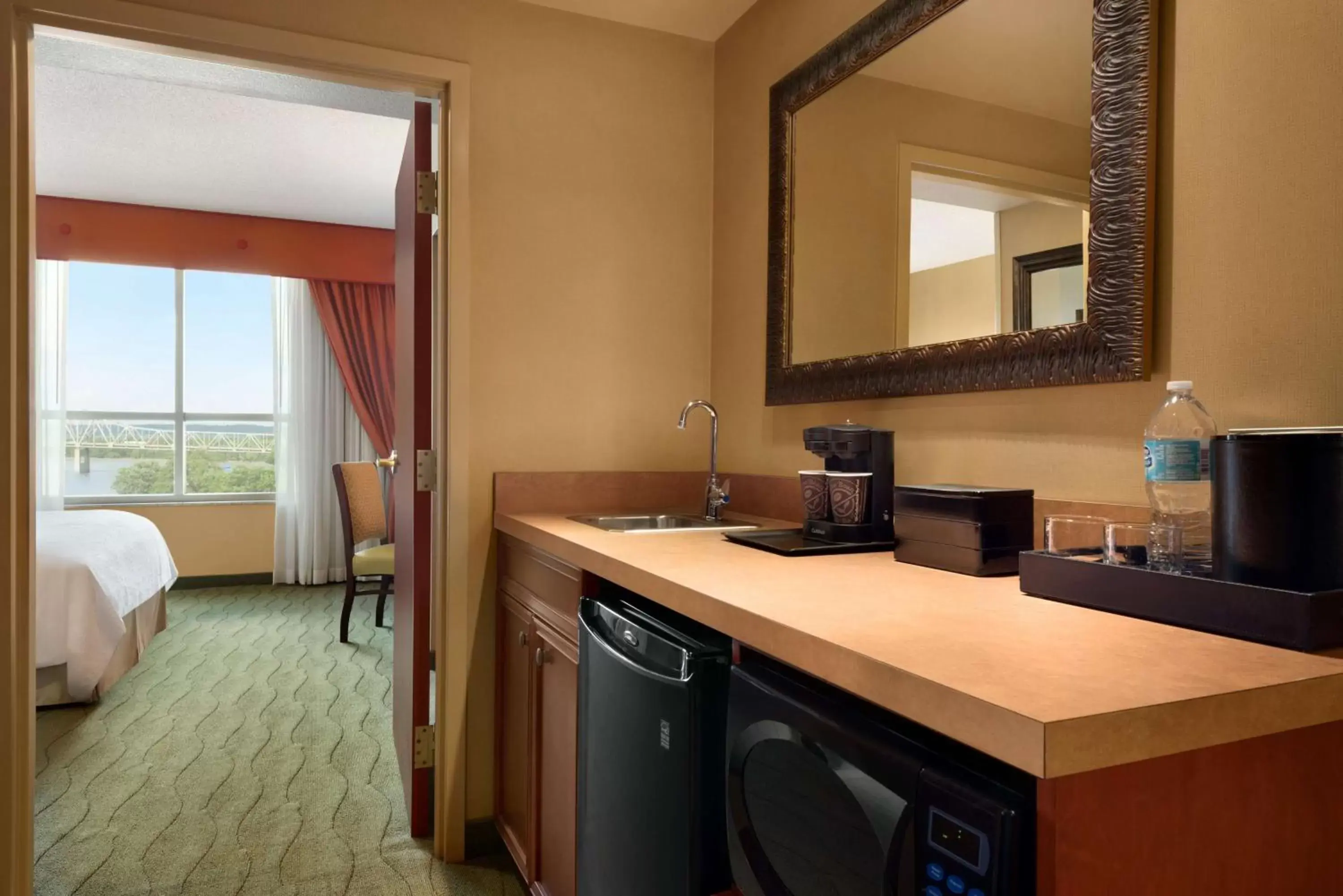 Bedroom, Bathroom in Embassy Suites East Peoria Hotel and Riverfront Conference Center