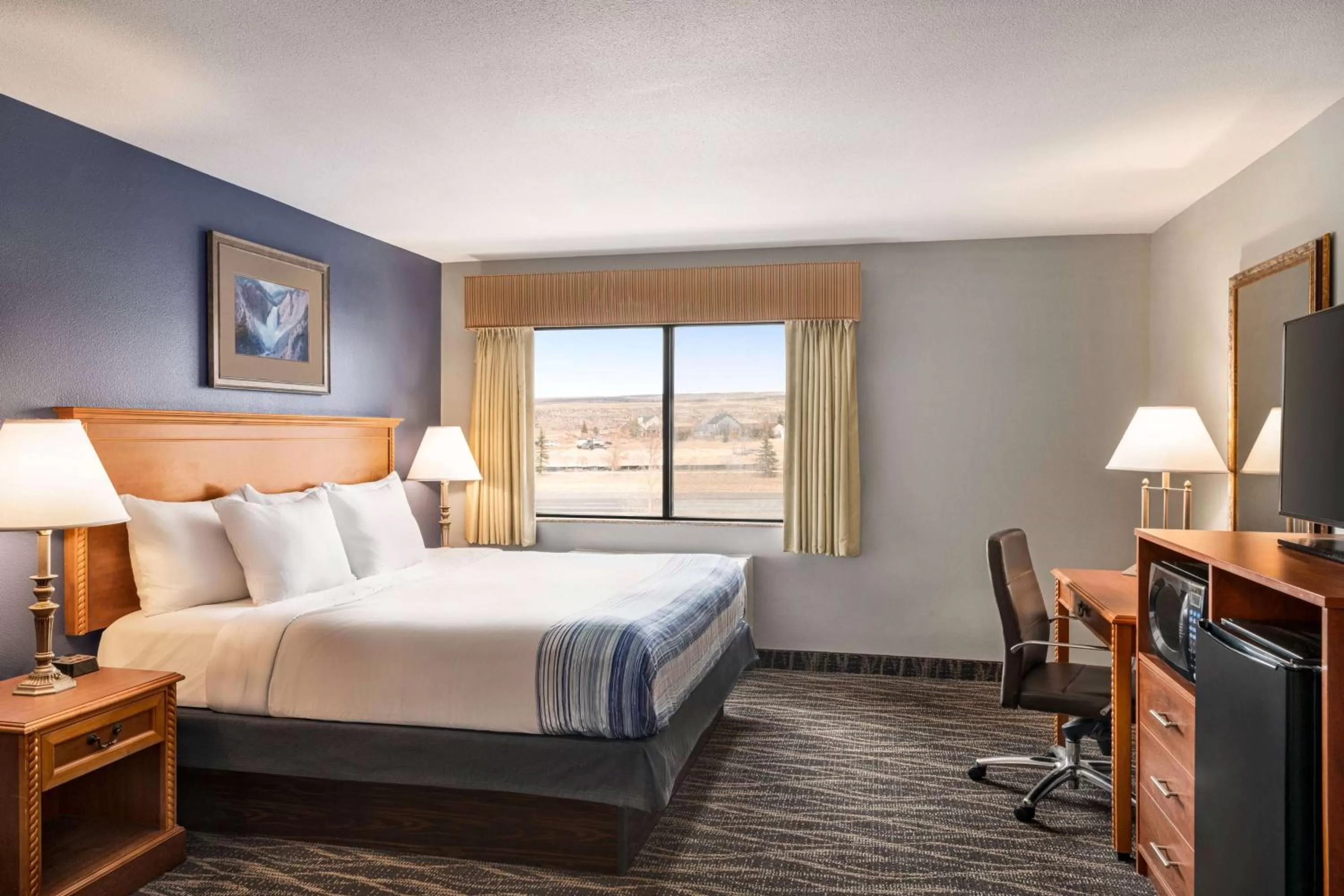 Photo of the whole room, Bed in AmericInn by Wyndham Laramie Near University of Wyoming