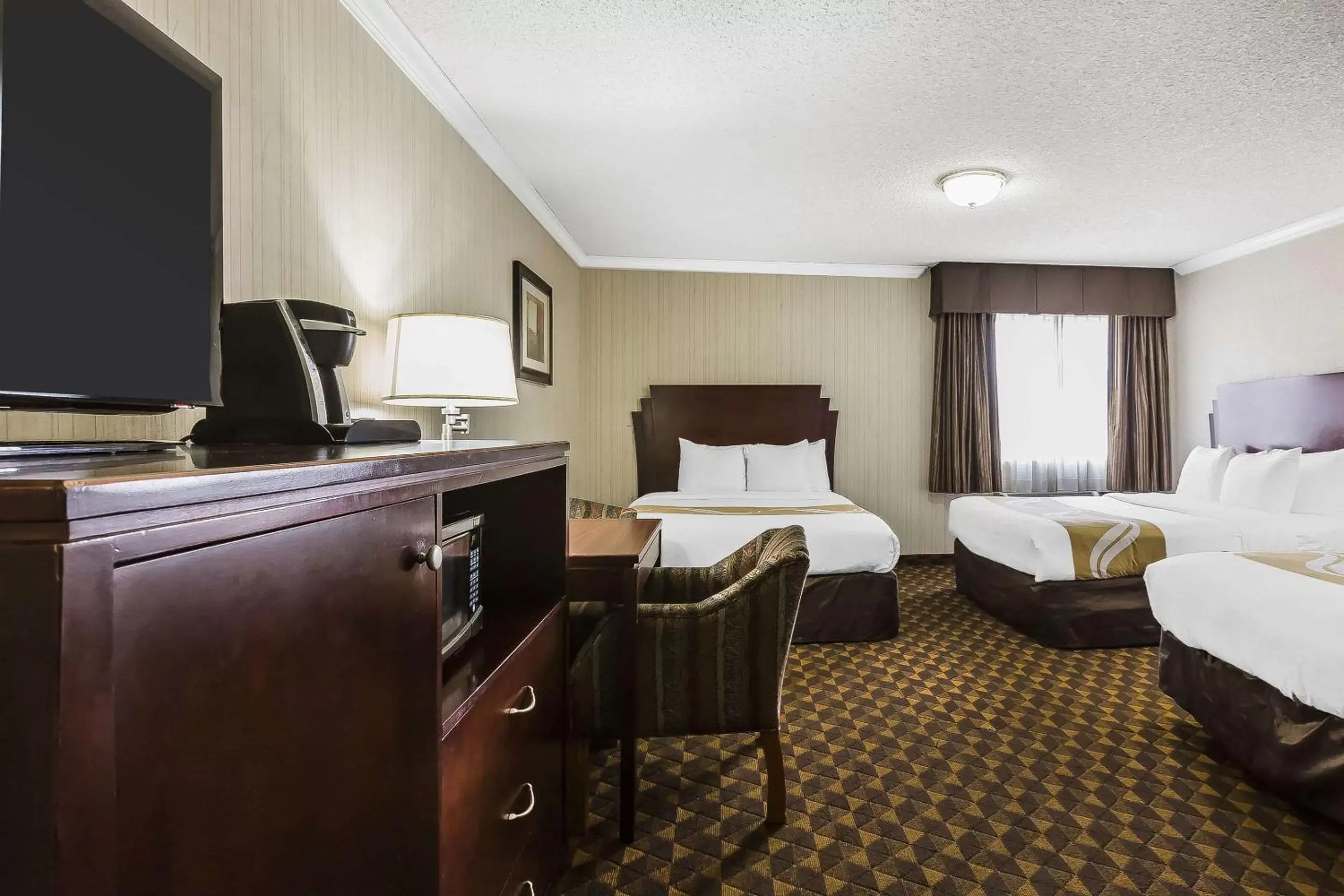 Photo of the whole room, TV/Entertainment Center in Quality Inn & Suites Los Angeles Airport - LAX