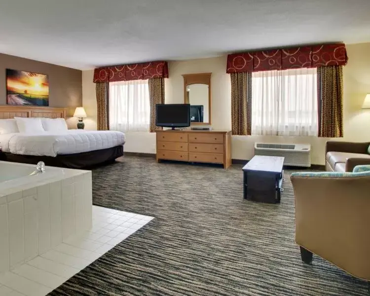 Bed, Seating Area in EverSpring Inn & Suites