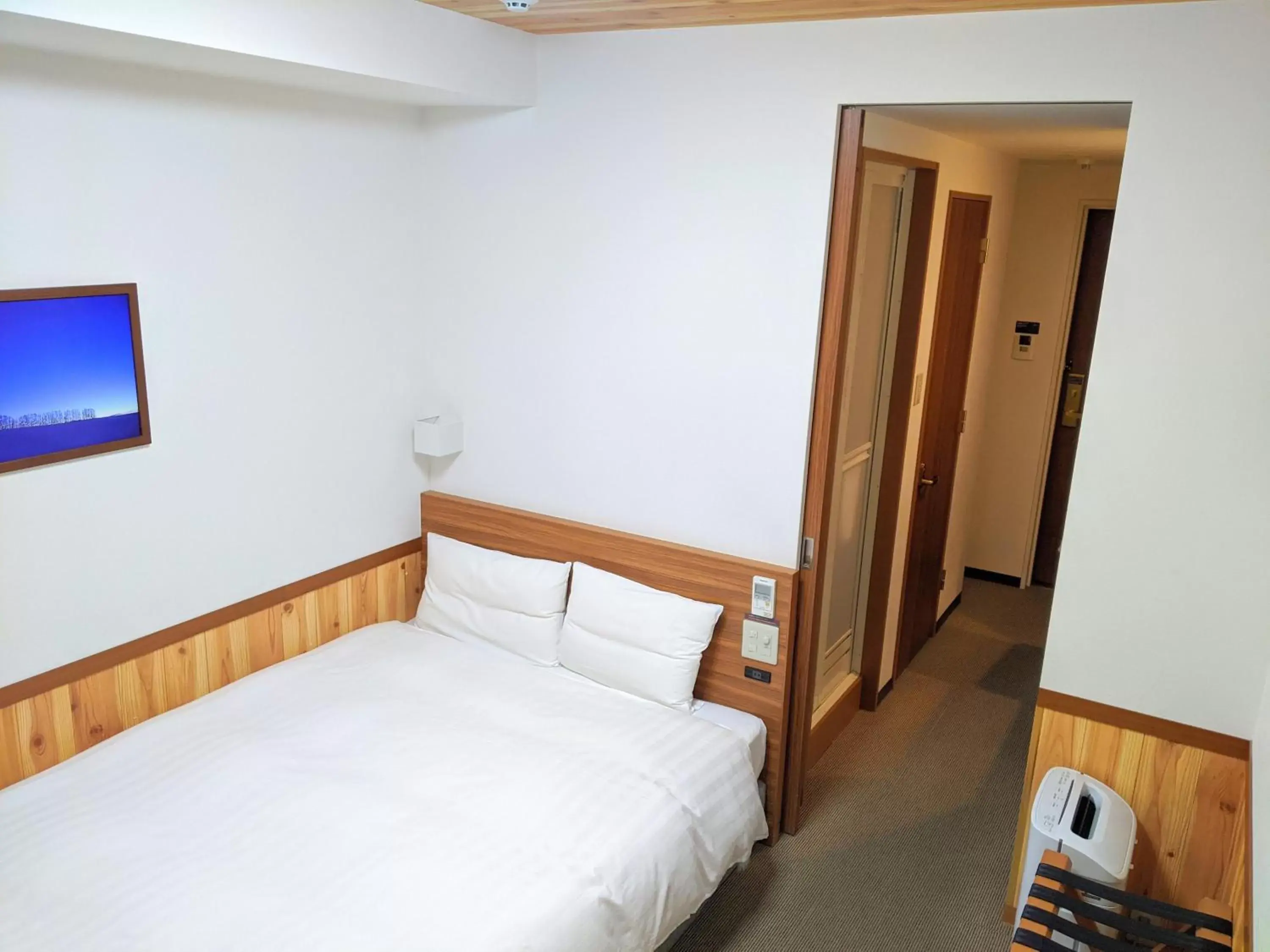 Bed in Dormy Inn Premium Sapporo