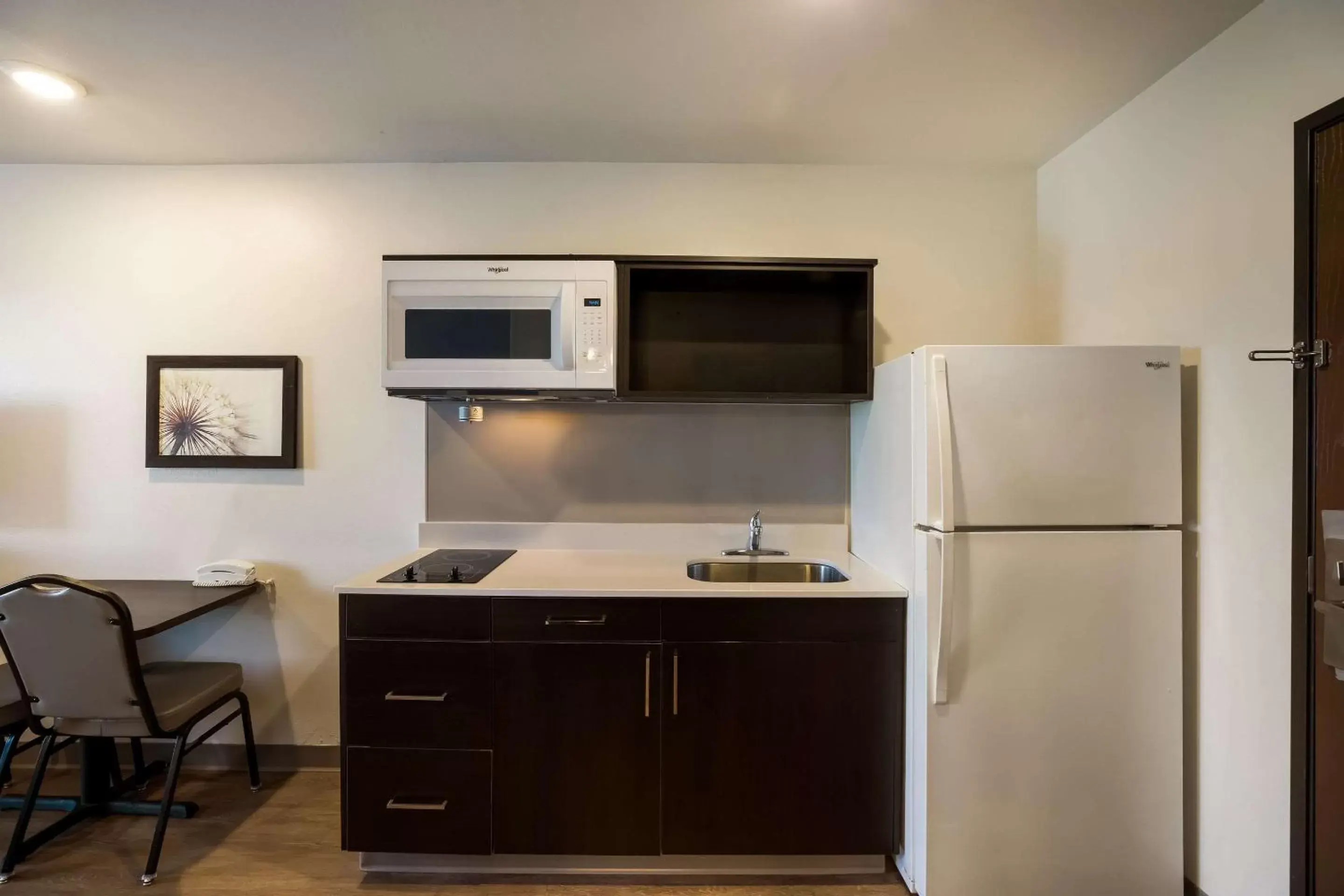 Bedroom, Kitchen/Kitchenette in WoodSpring Suites Orlando West - Clermont