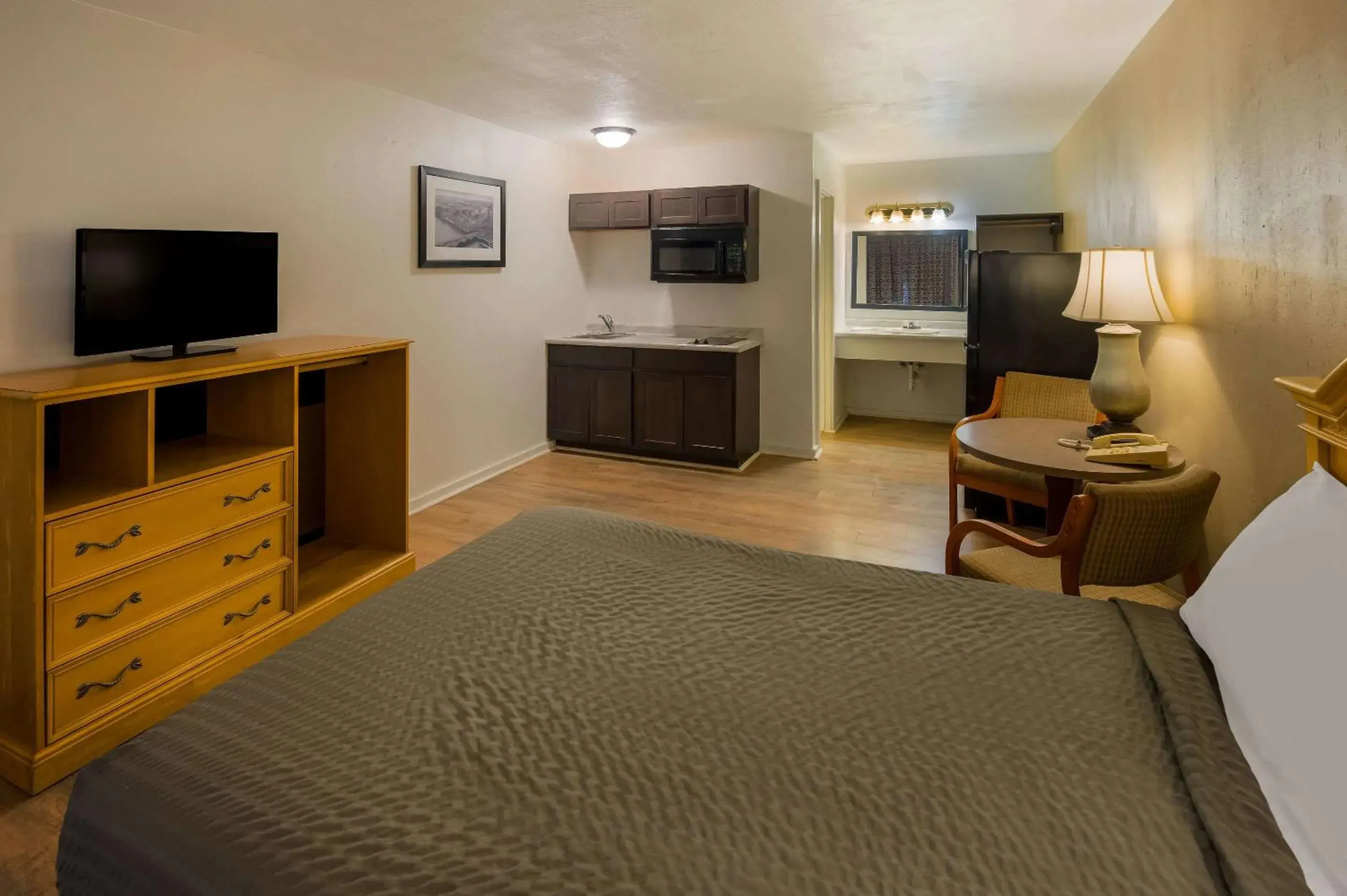 Bedroom, TV/Entertainment Center in Suburban Studios Brazil