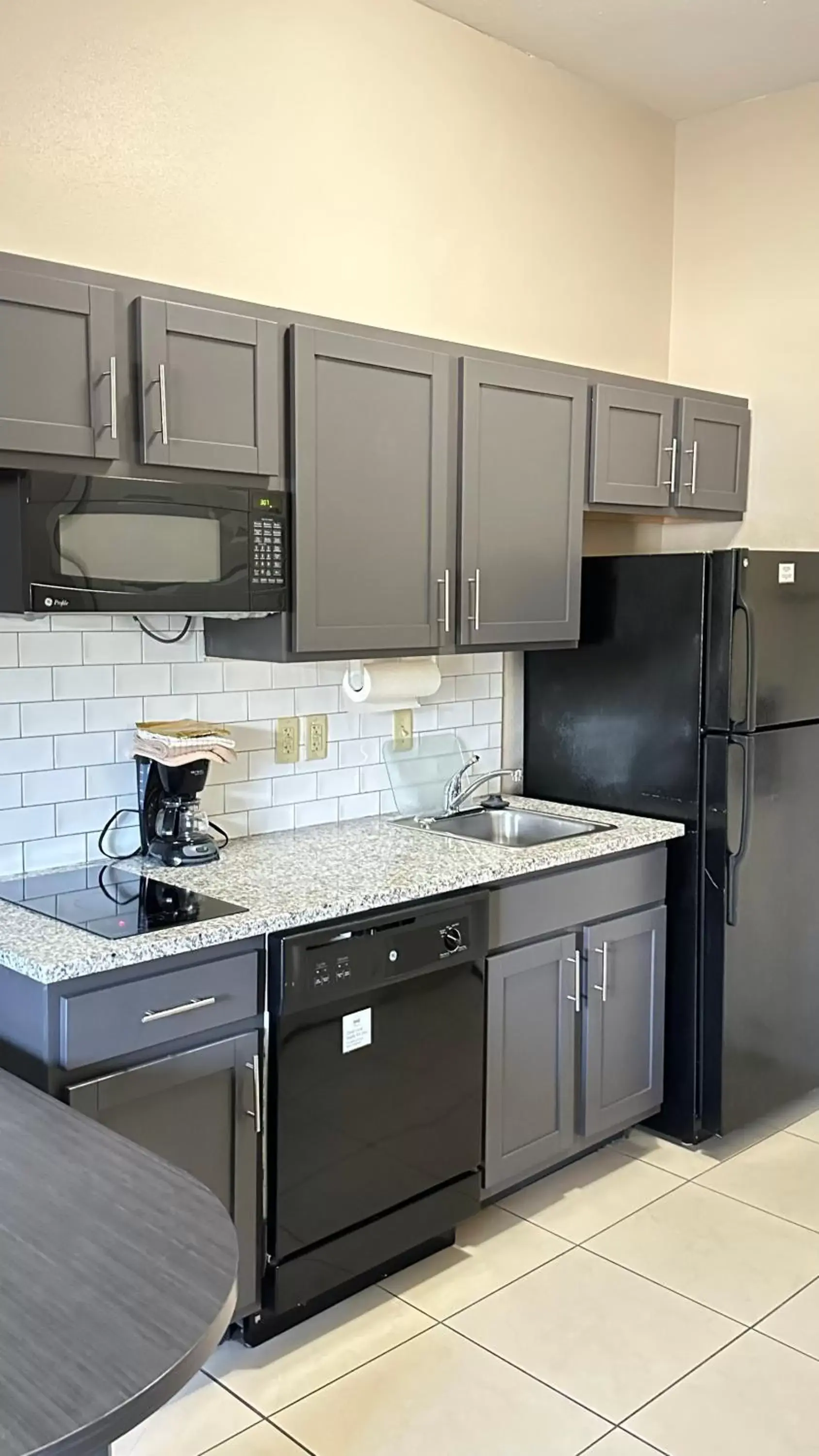 Kitchen or kitchenette, Kitchen/Kitchenette in Candlewood Suites South Bend Airport, an IHG Hotel