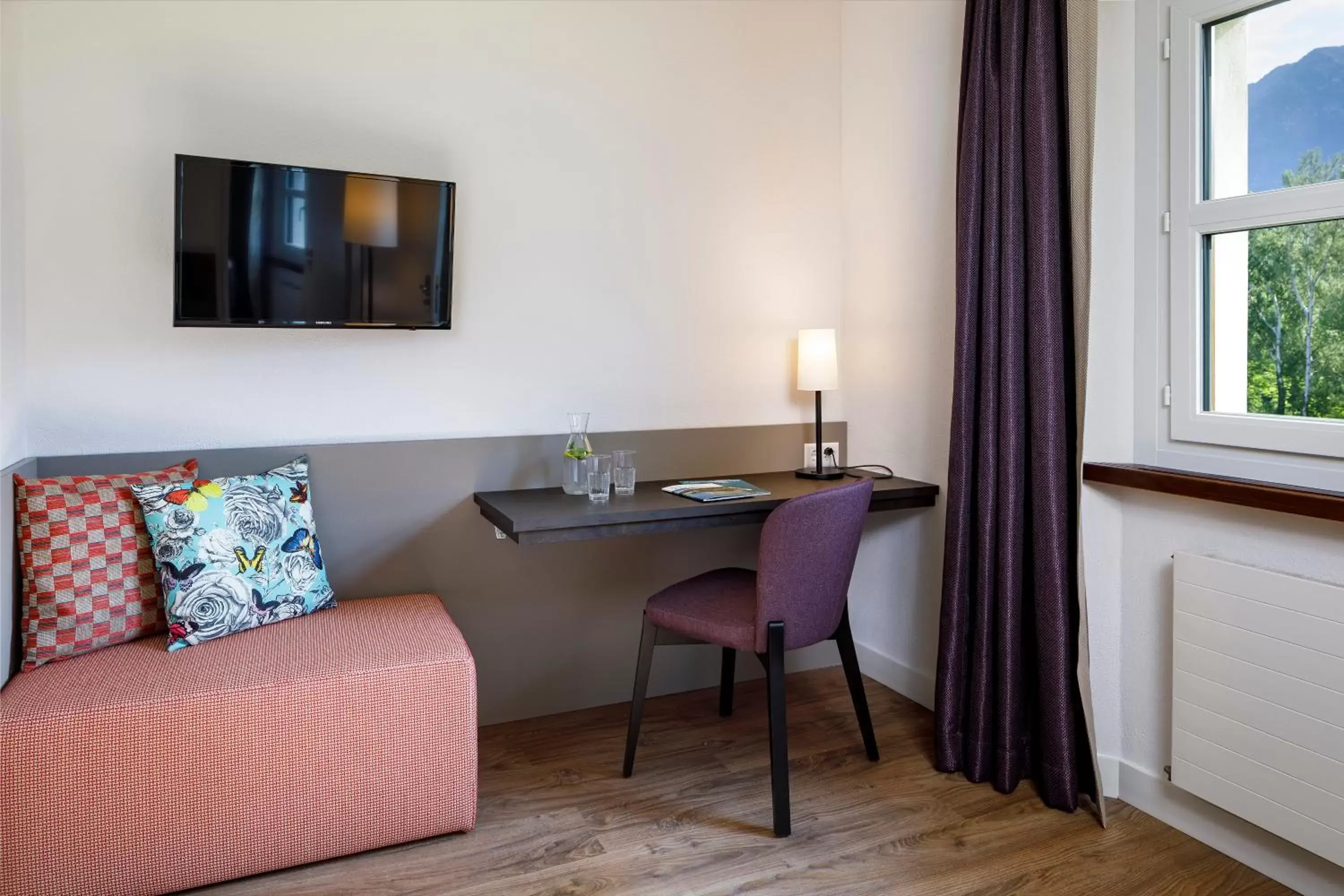 Bedroom, Seating Area in Hotel Bellinzona Sud Swiss Quality