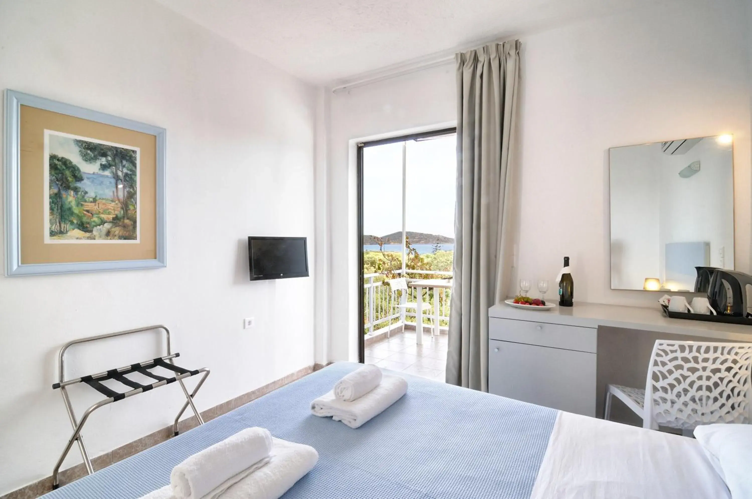 Photo of the whole room, Bed in Elounda Krini Hotel Photo of the whole room, Bed in Elounda Krini Hotel