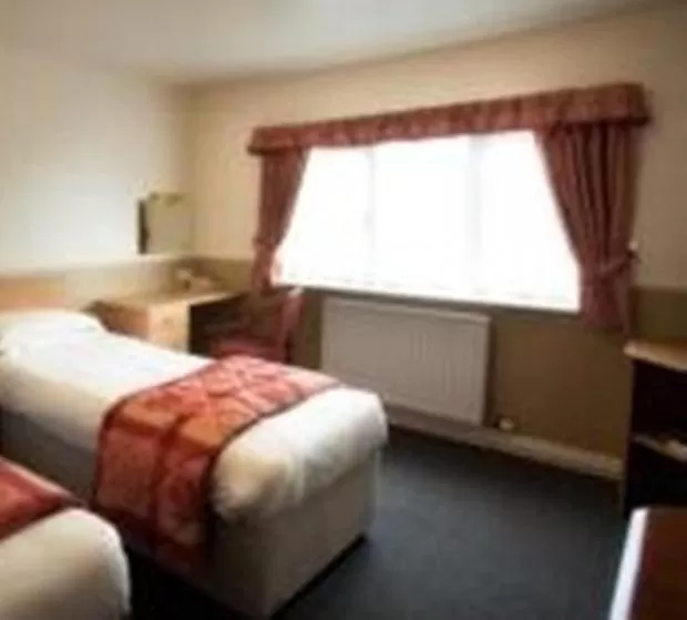 Bed in Moreton Park Hotel