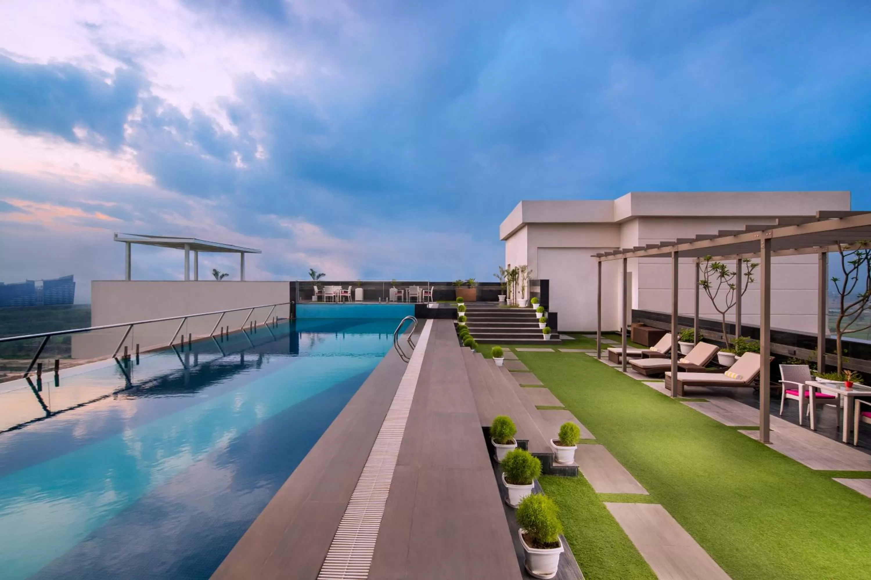 Swimming pool in Sandal Suites by Lemon Tree Hotels