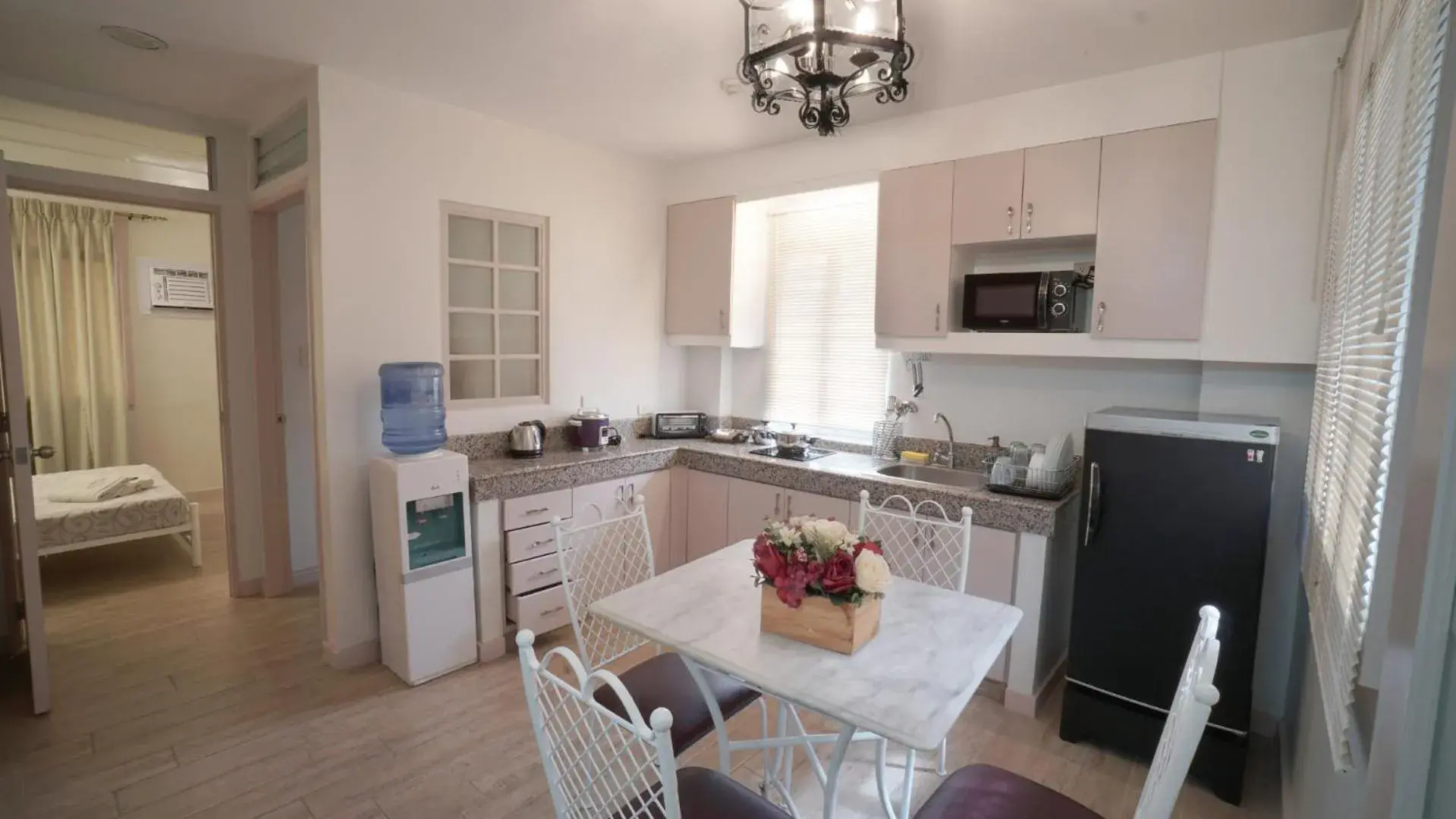 Kitchen or kitchenette, Dining Area in 1775 Adriatico Suites