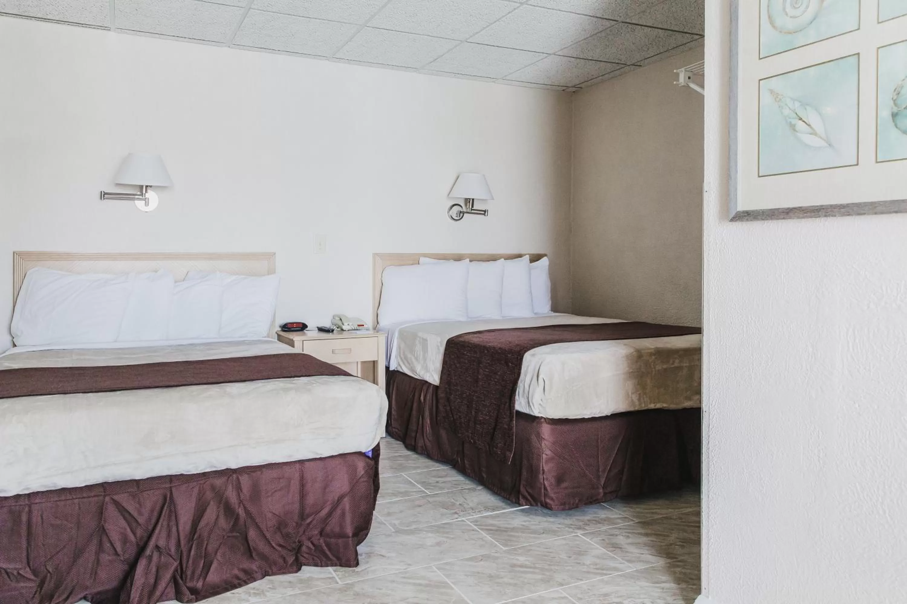 Bed in Heart of Wildwood Boardwalk Motel