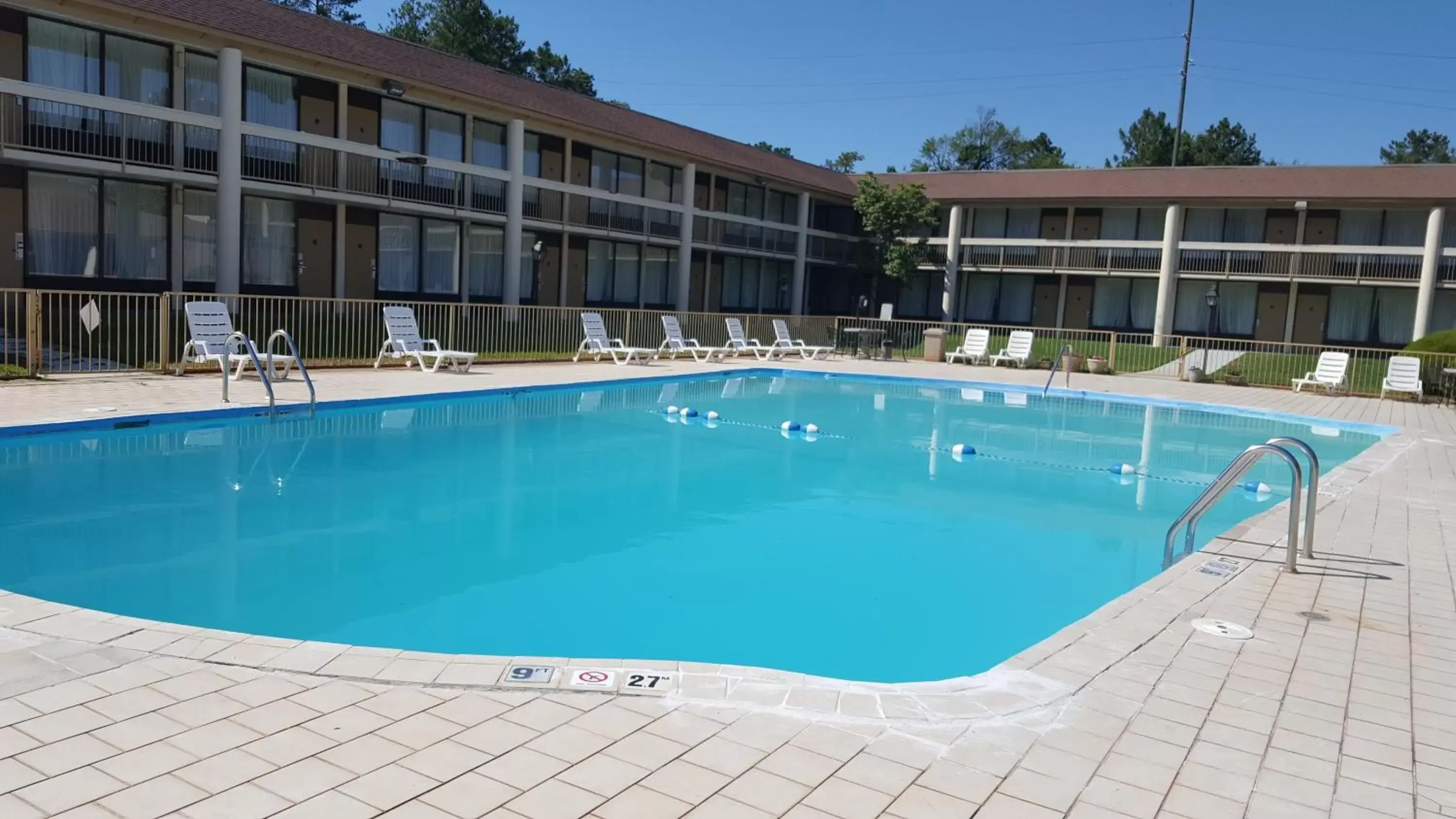 Swimming pool, Property Building in Days Inn & Conf Center by Wyndham Southern Pines Pinehurst