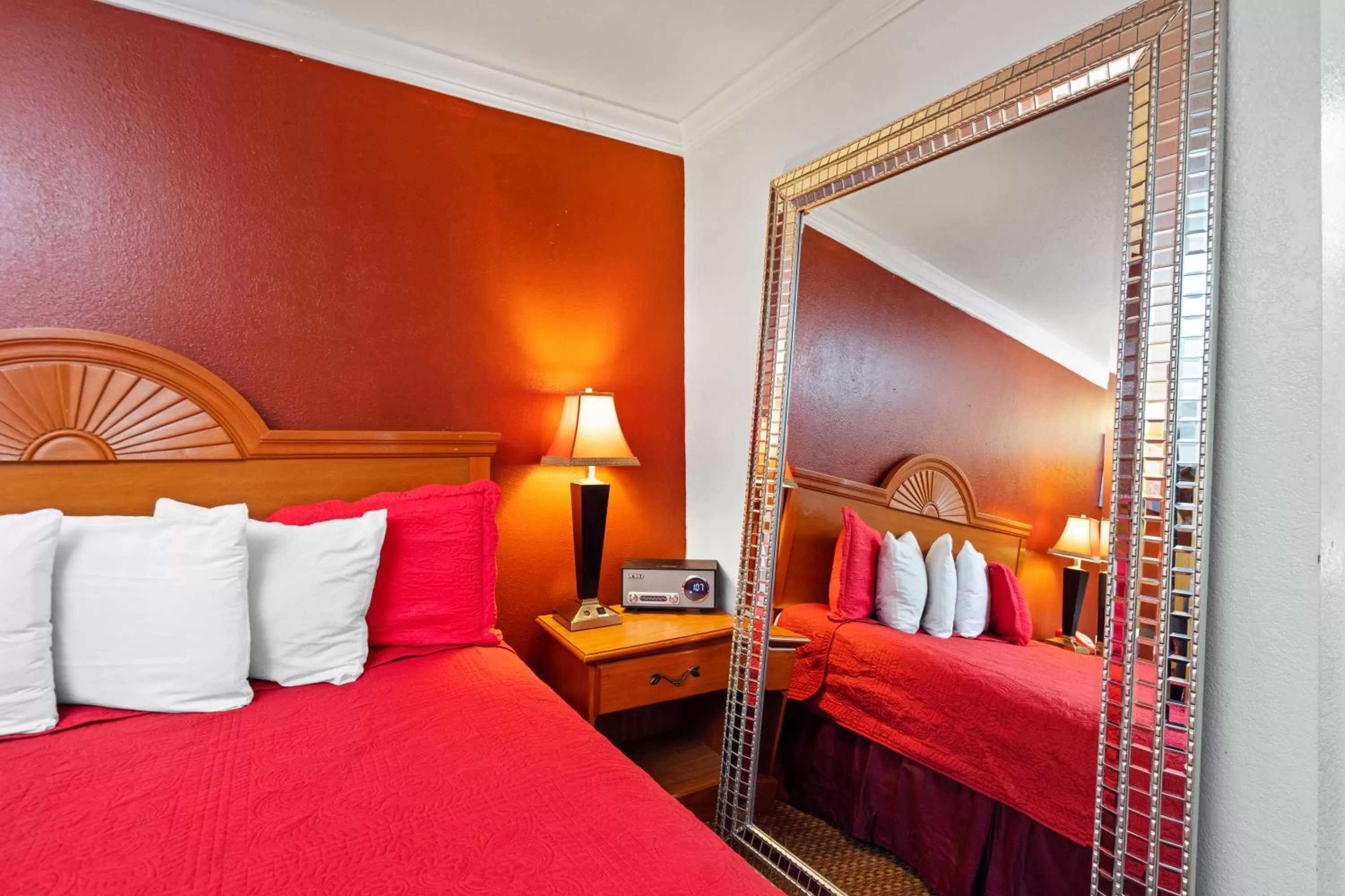 Bed in Americana Inn Motel