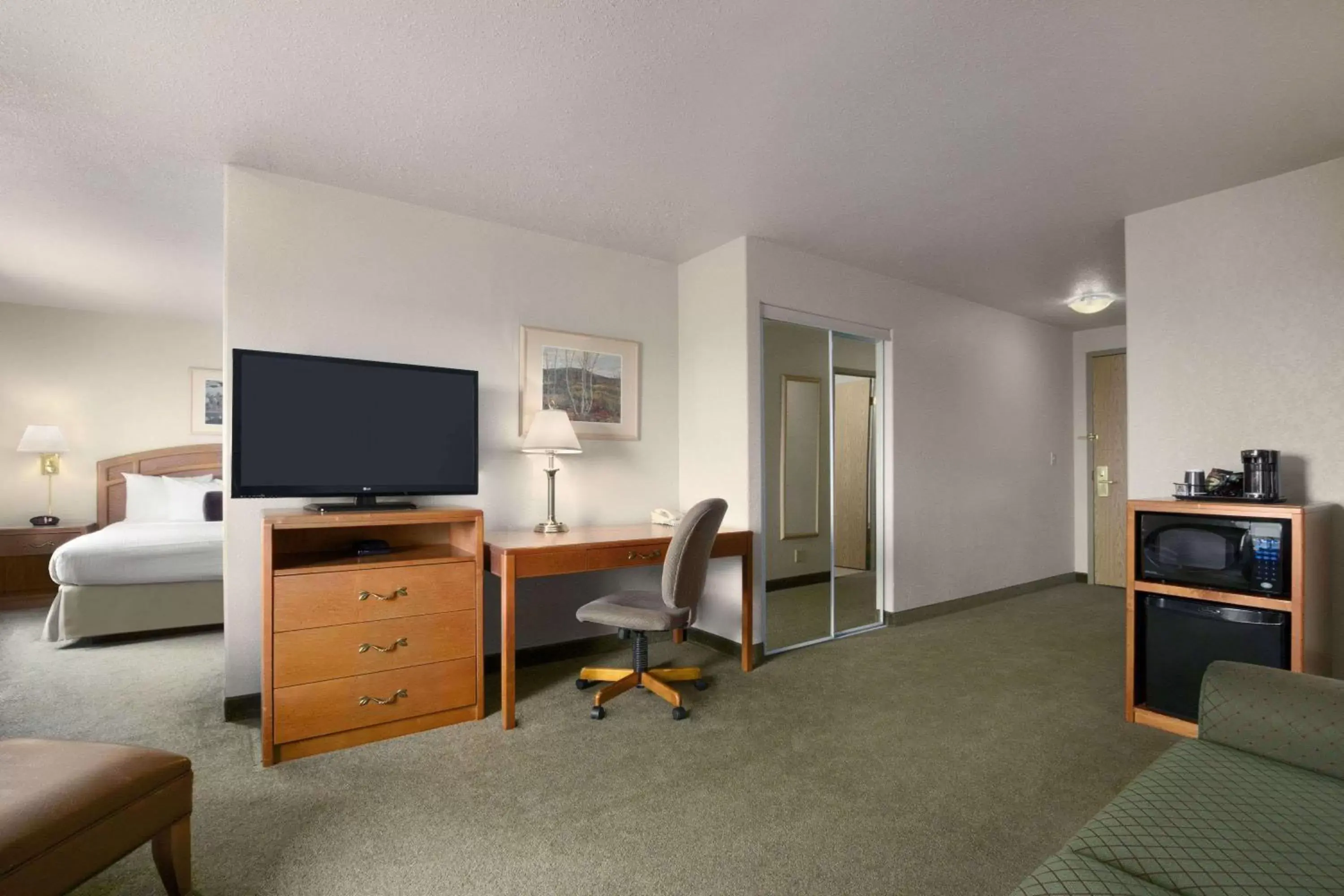 Photo of the whole room, TV/Entertainment Center in Days Inn by Wyndham Red Deer