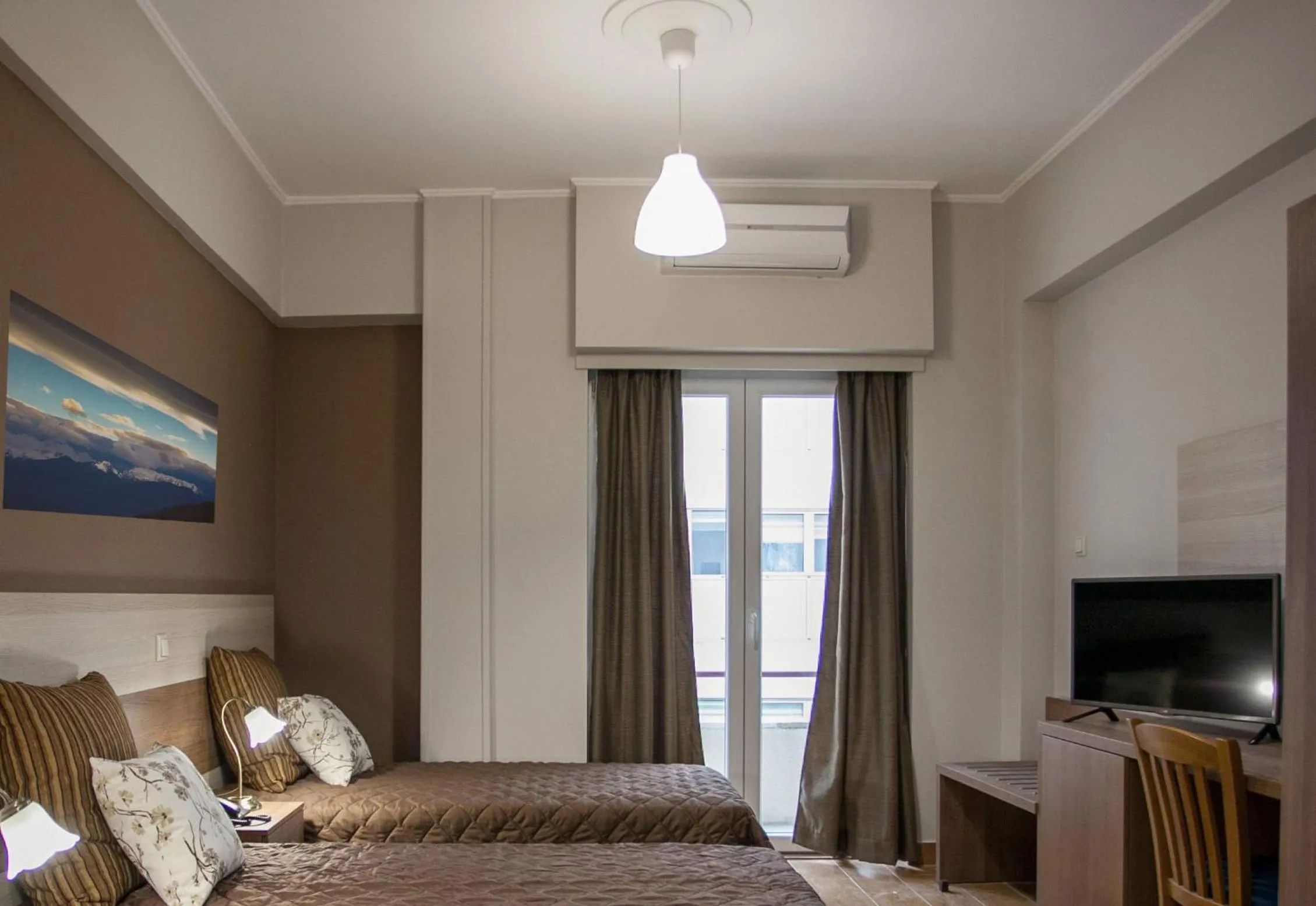 Bed in Ambrosia Suites