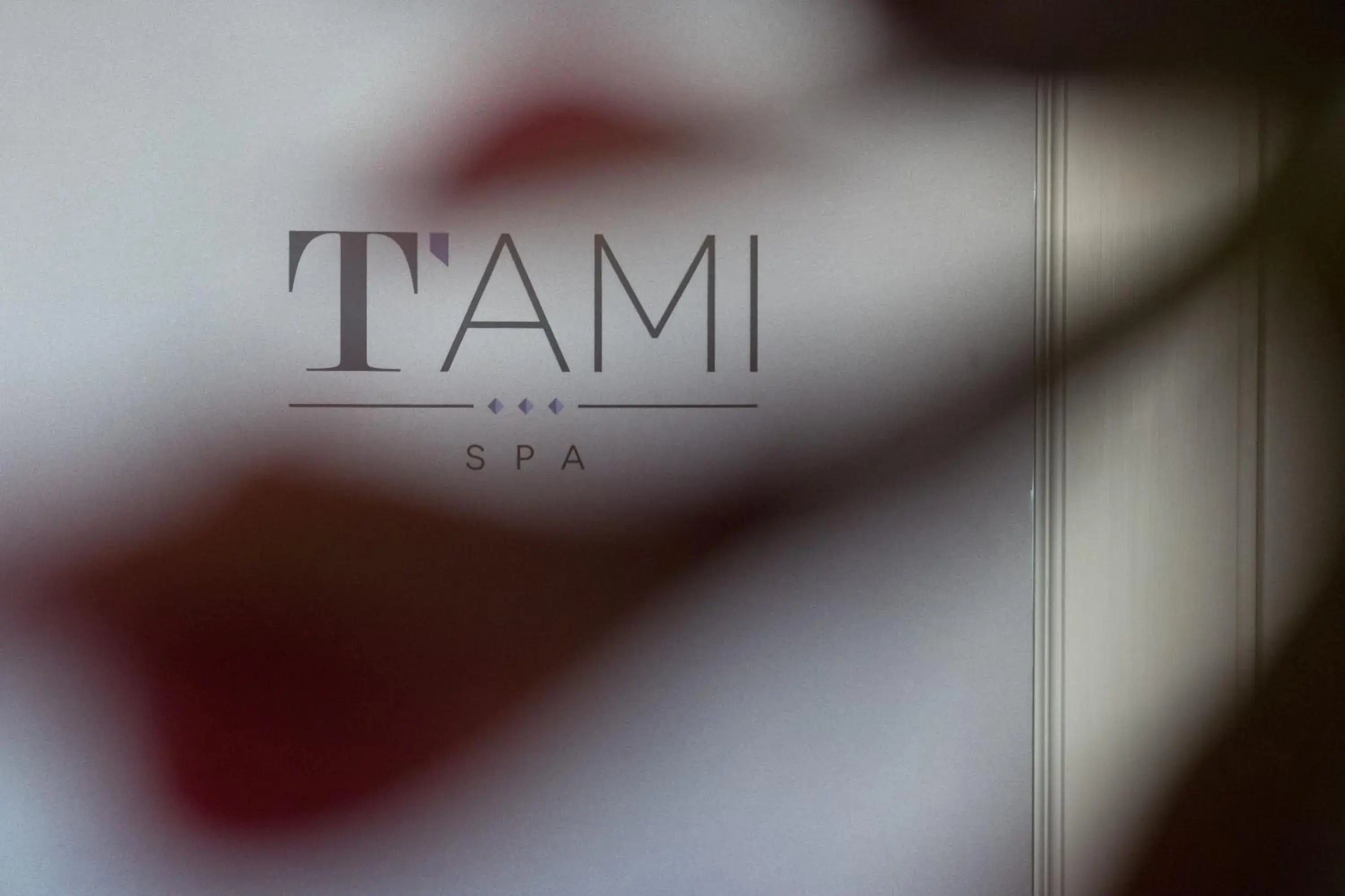 Property logo or sign in T'ami Hotel Resort Spa