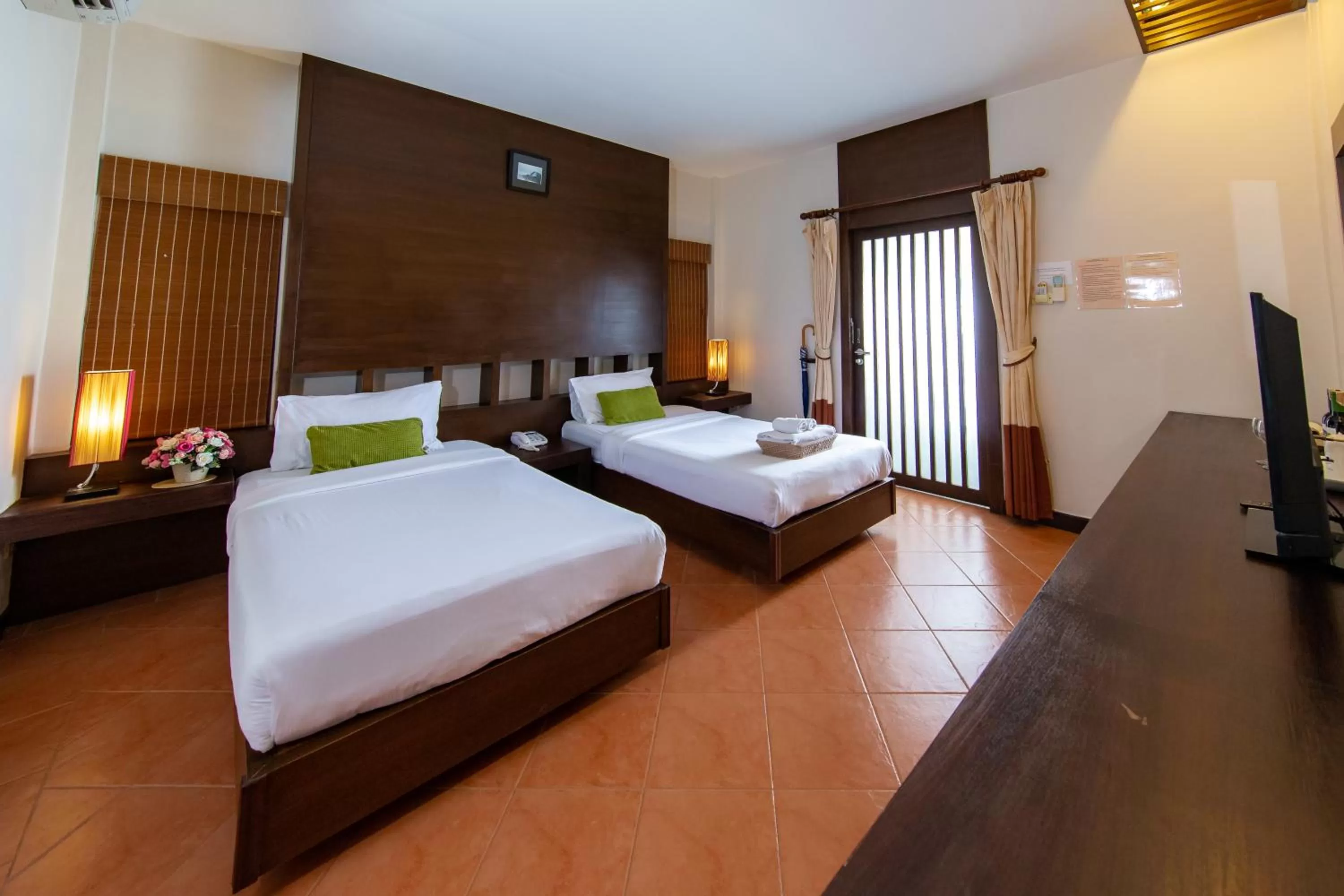 Photo of the whole room, Bed in The RiverKwai Bridge Resort