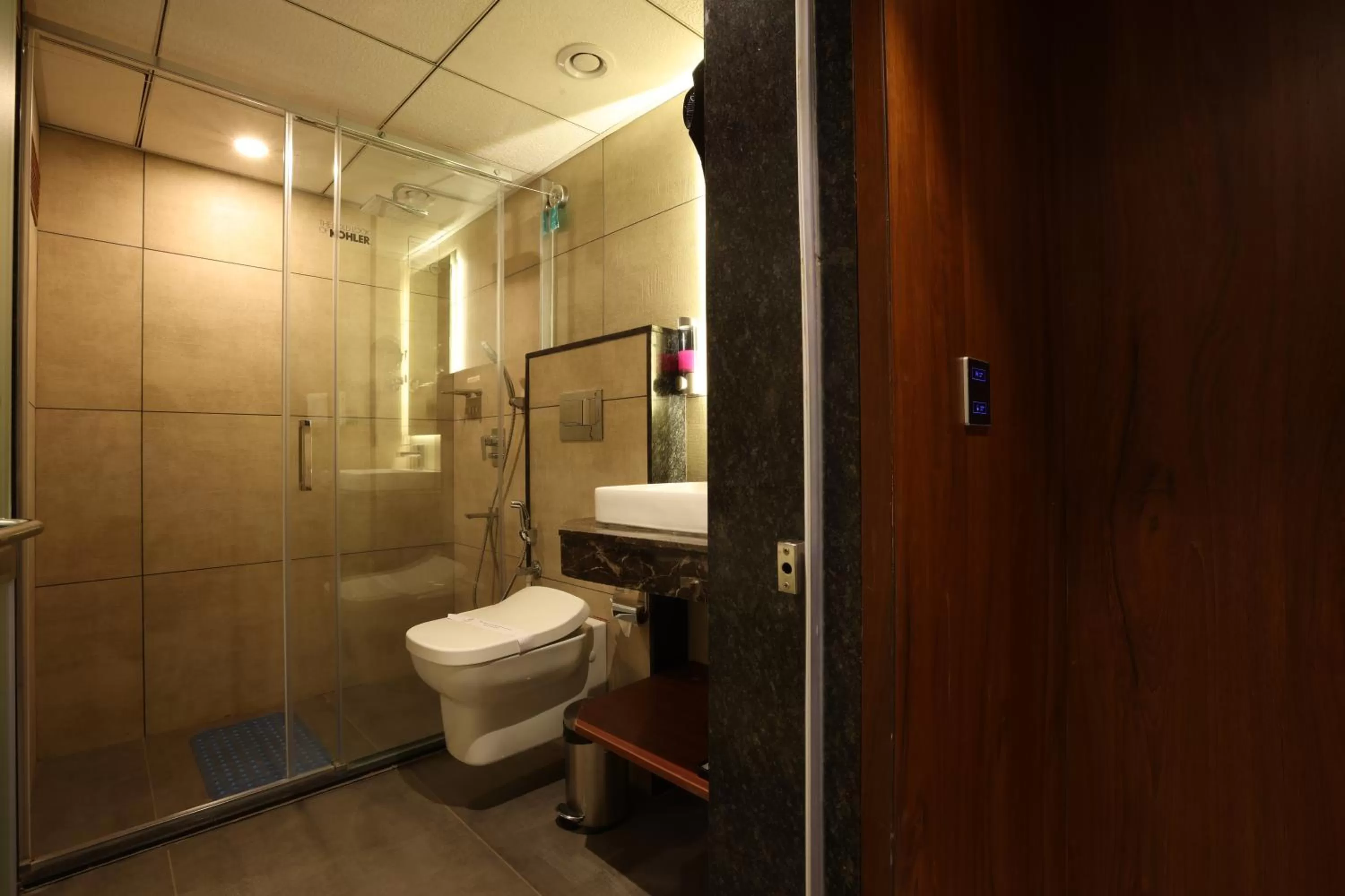Bathroom in Royal Plaza Suites by RAK Rooms, Mangaluru