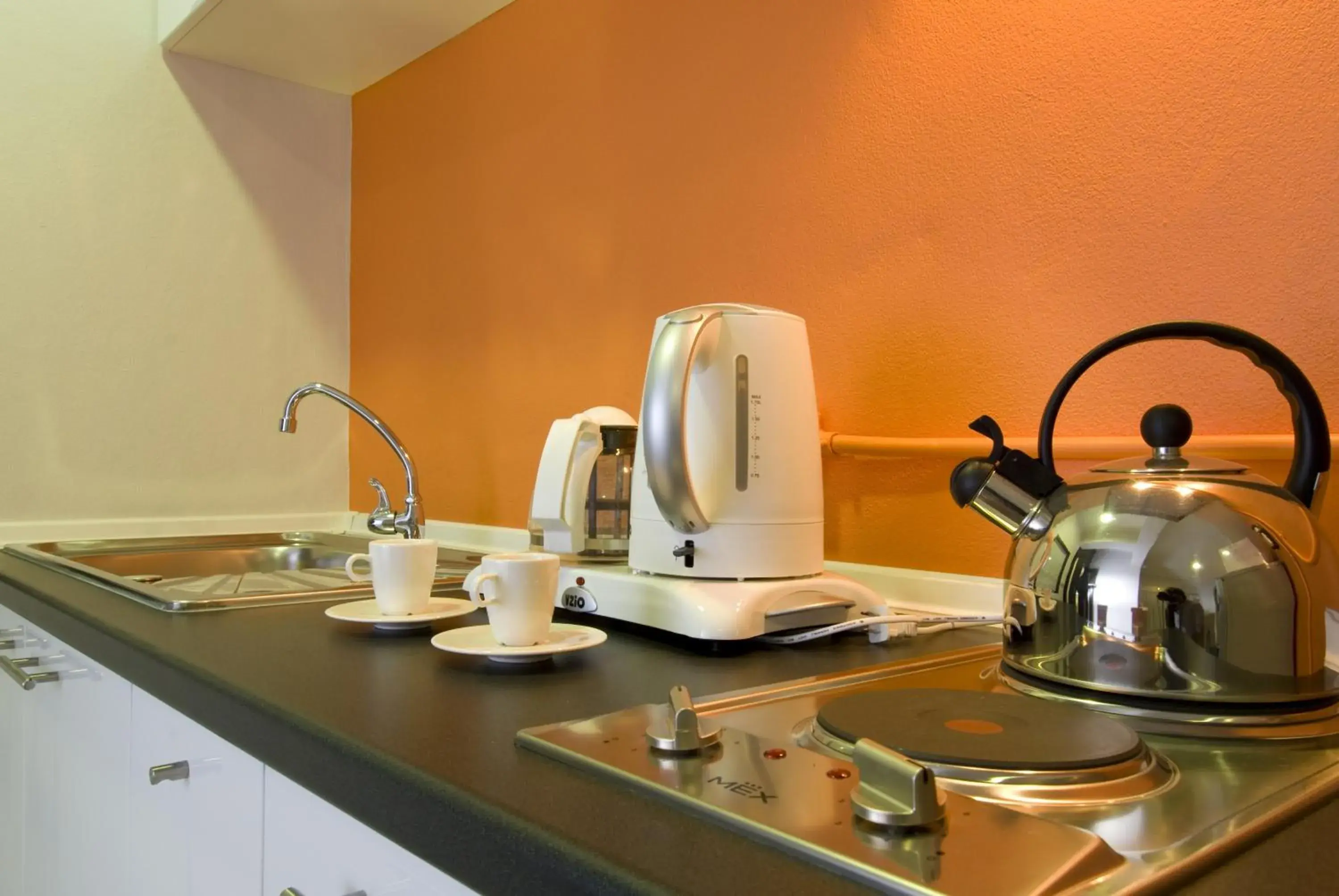 Coffee/tea facilities, Kitchen/Kitchenette in T Series Place Serviced Apartment