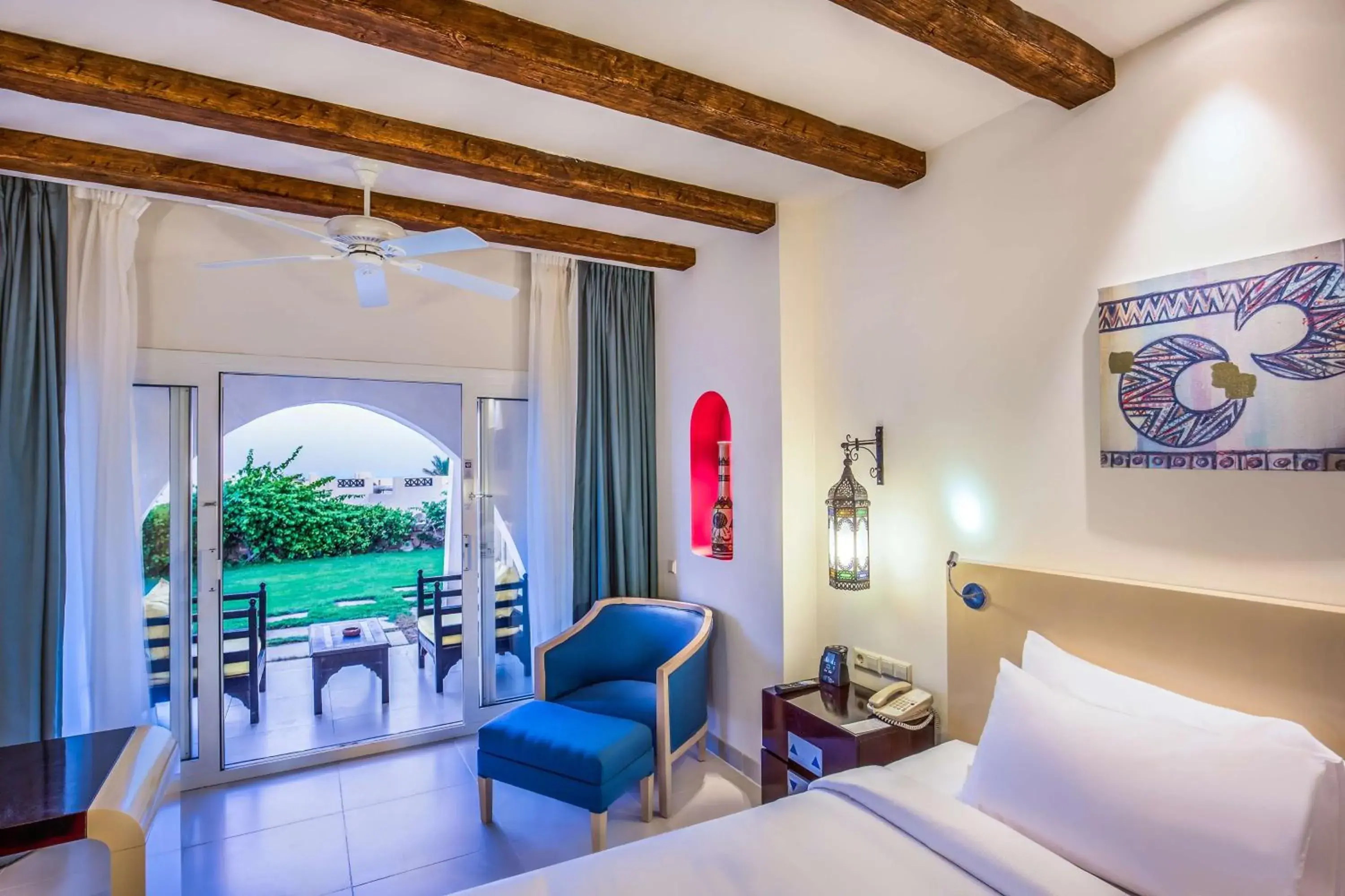 Bed, Seating Area in Hilton Marsa Alam Nubian Resort