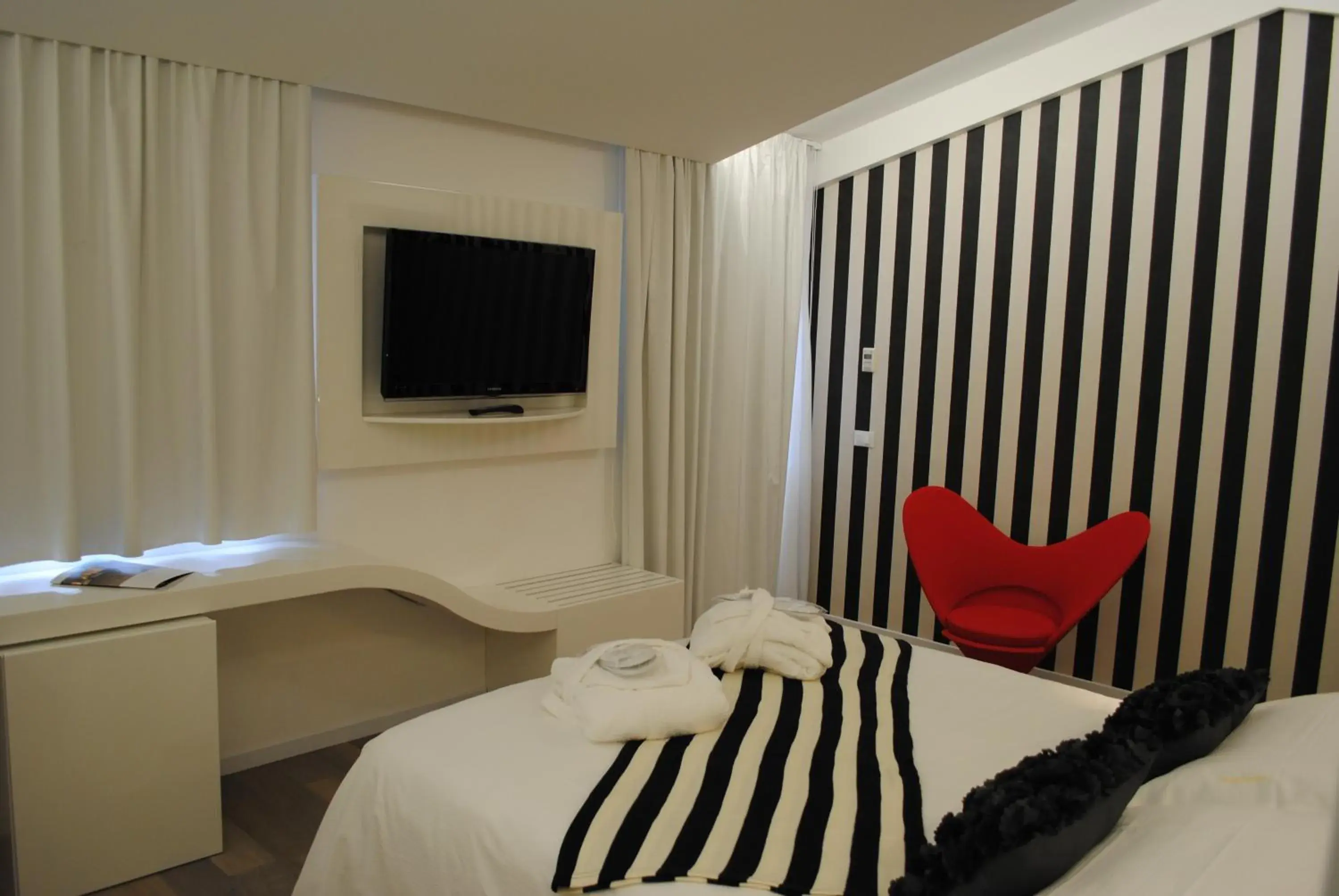 Bed, TV/Entertainment Center in Hotel Borgo Pantano