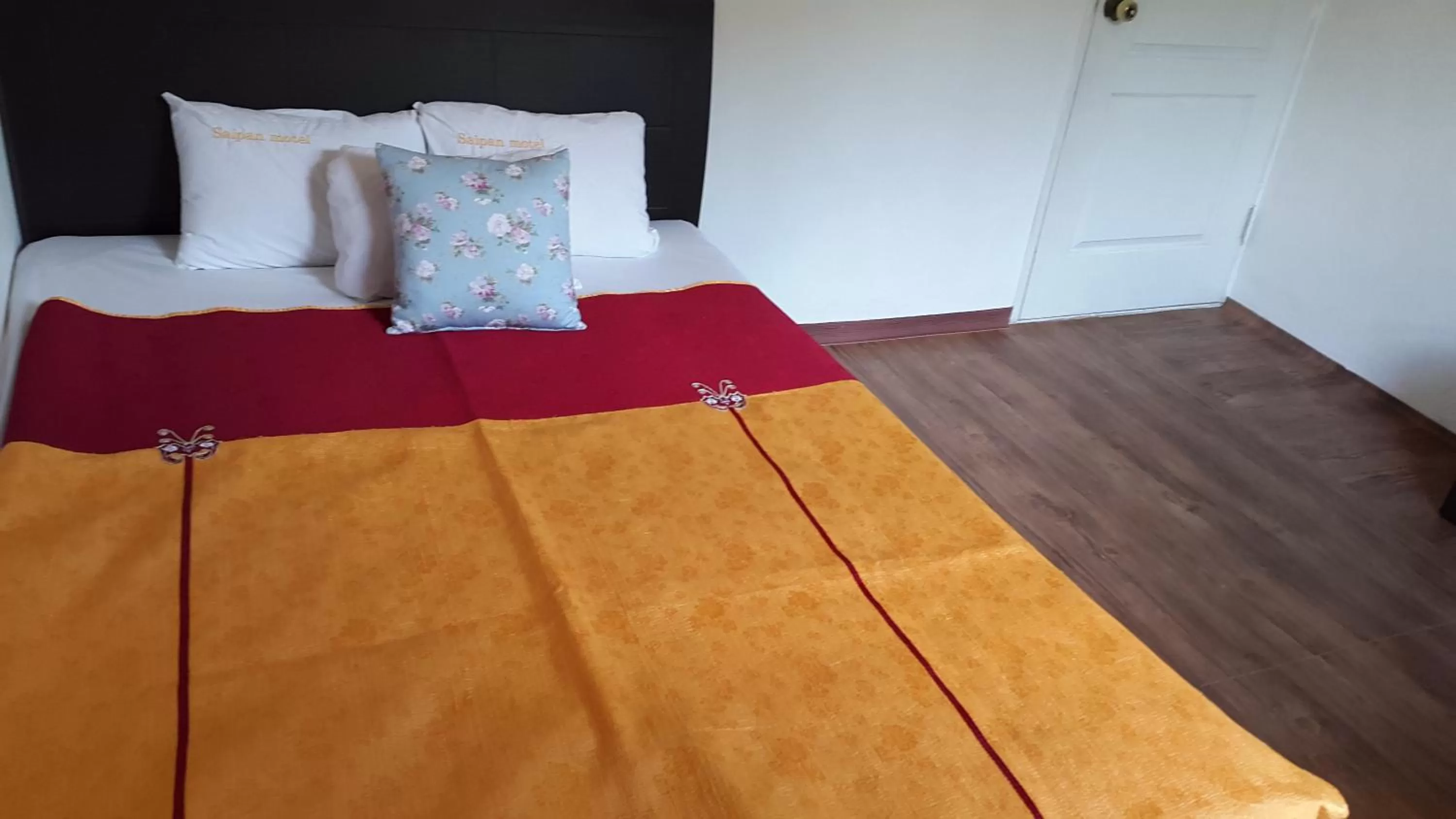 Bed in Saipan Motel with Sea View