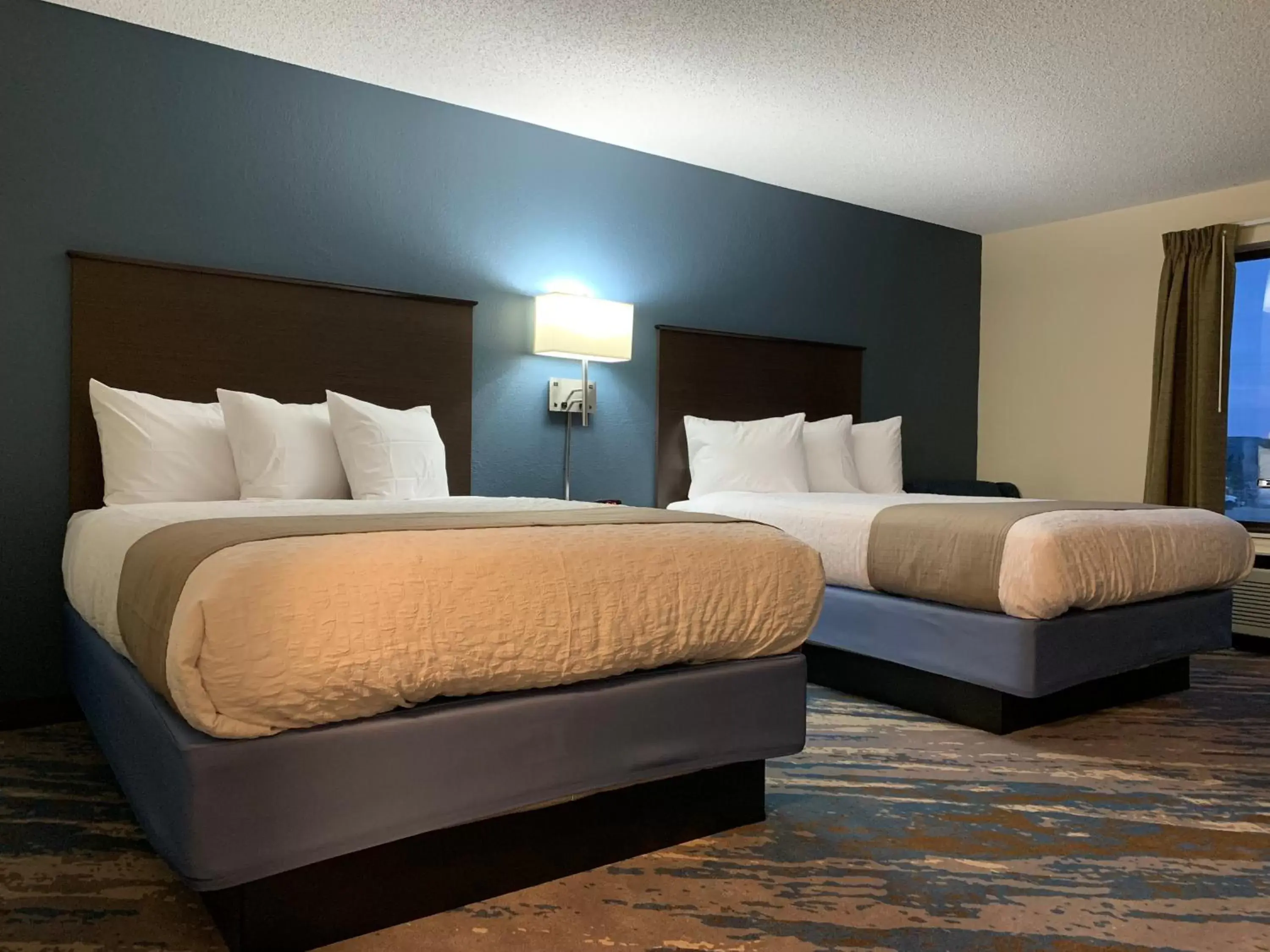 Bed in AmericInn by Wyndham Prairie du Chien