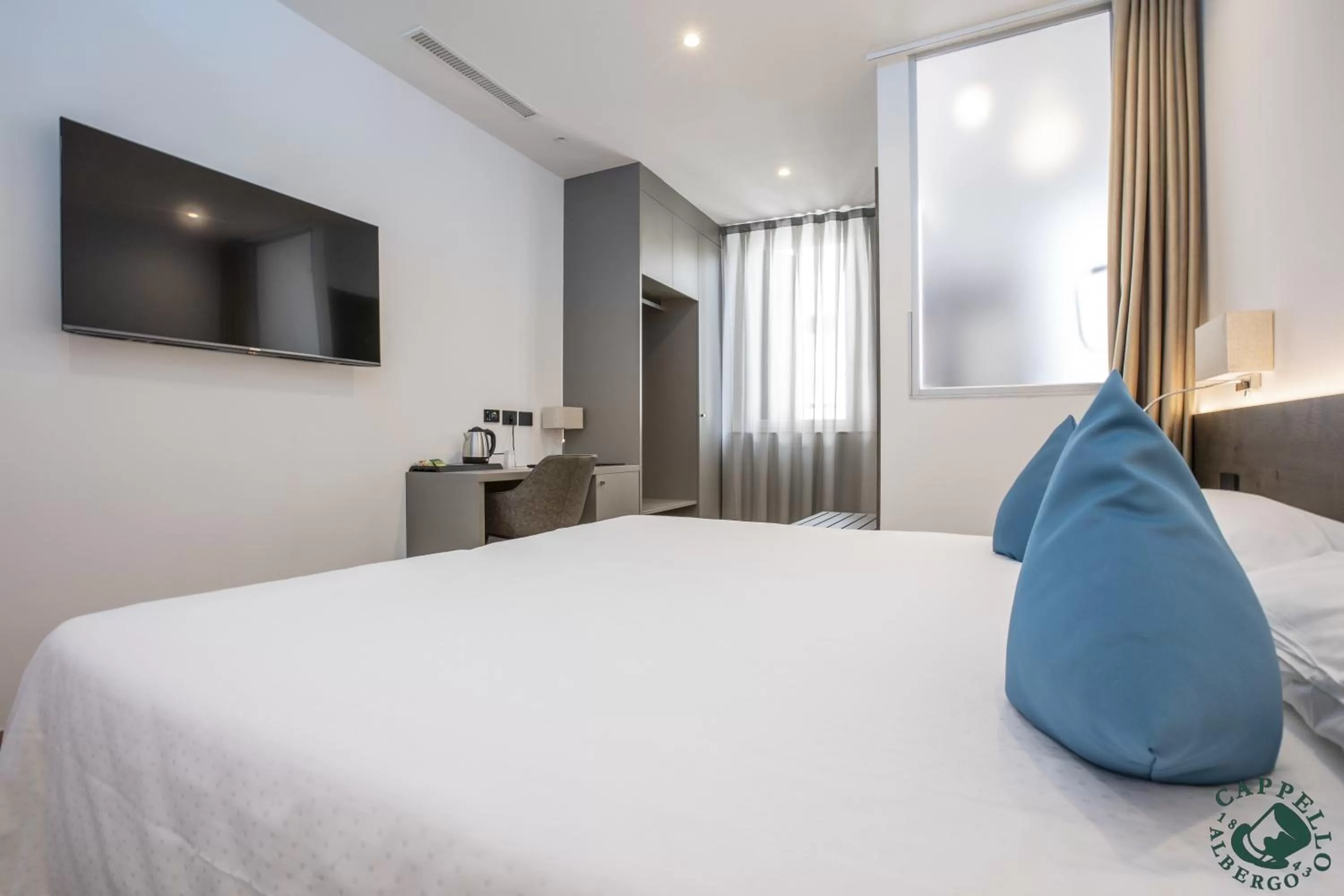 Bed in Albergo Cappello e Cadore