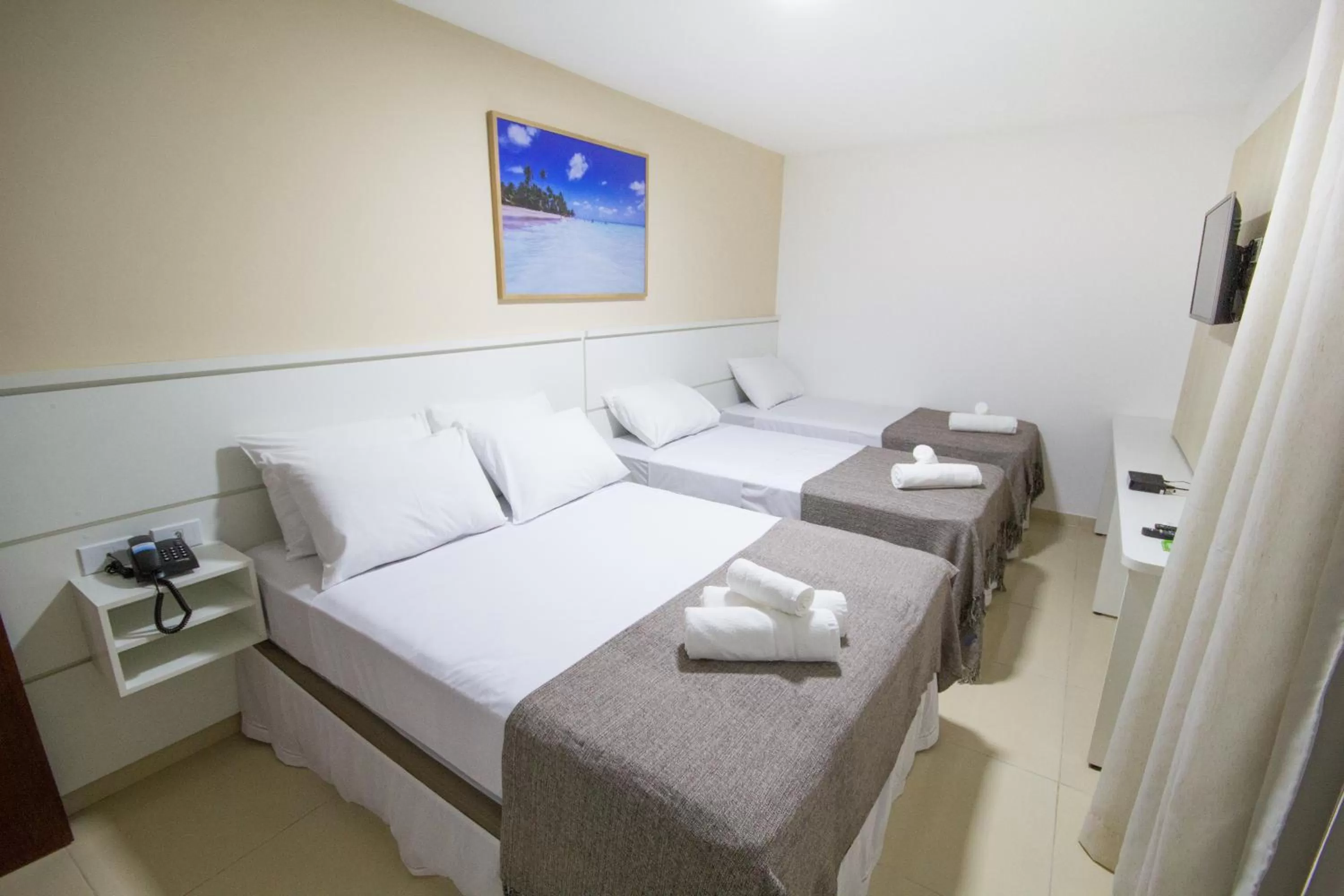 Bed in Pousada Kanoas