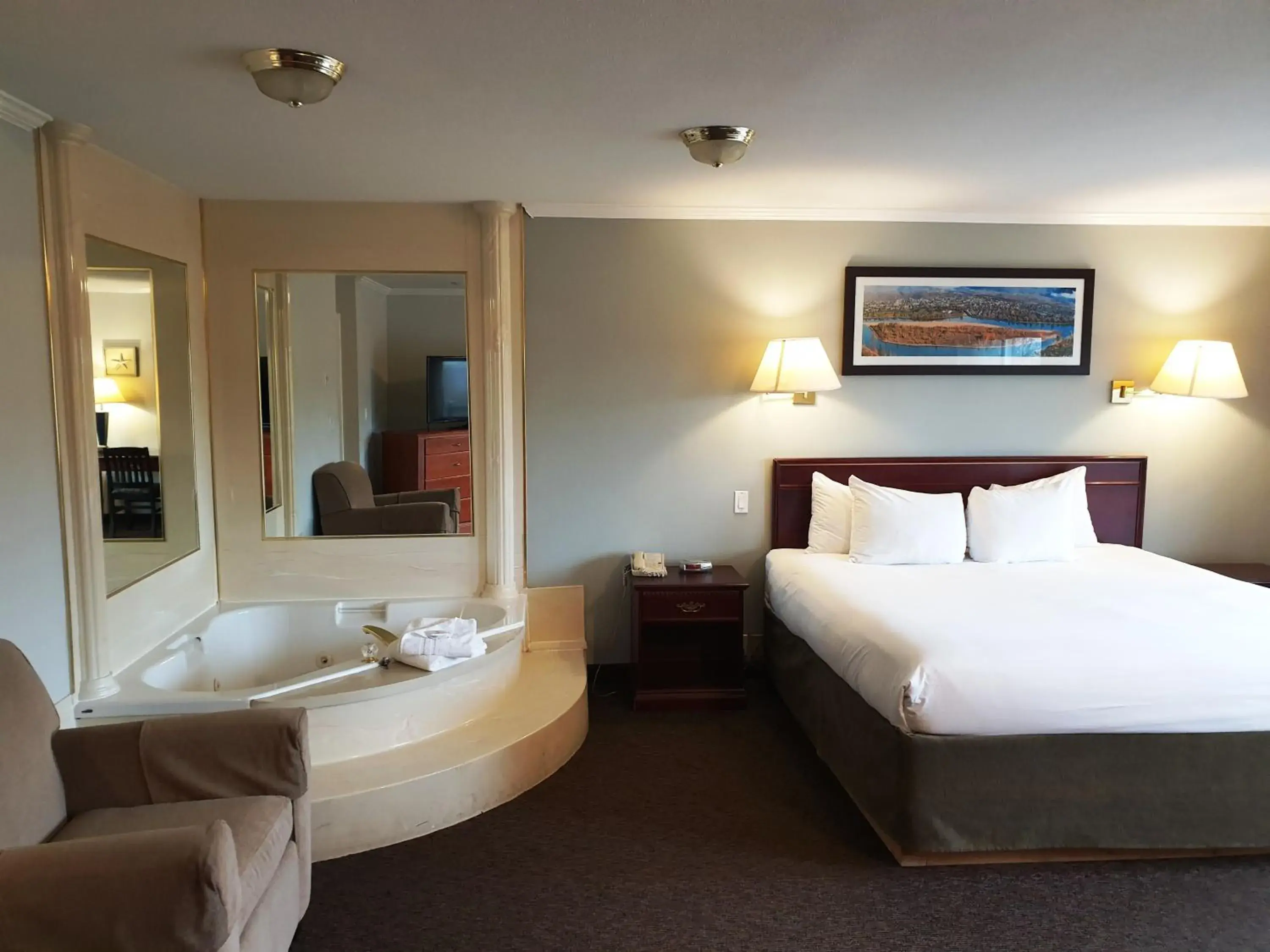 Bed in Riverland Inn & Suites