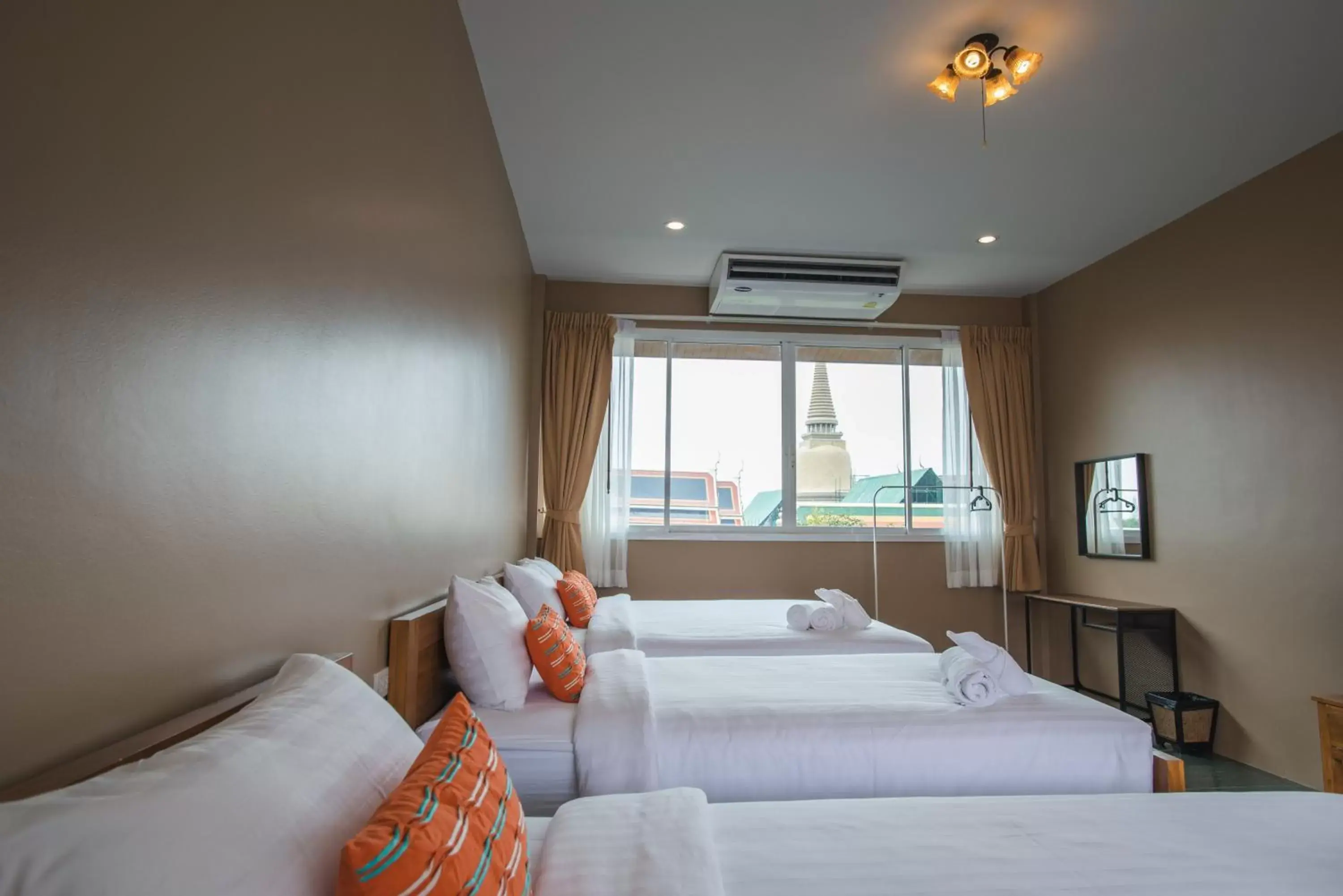 Bed in Feung Nakorn Balcony Rooms and Cafe
