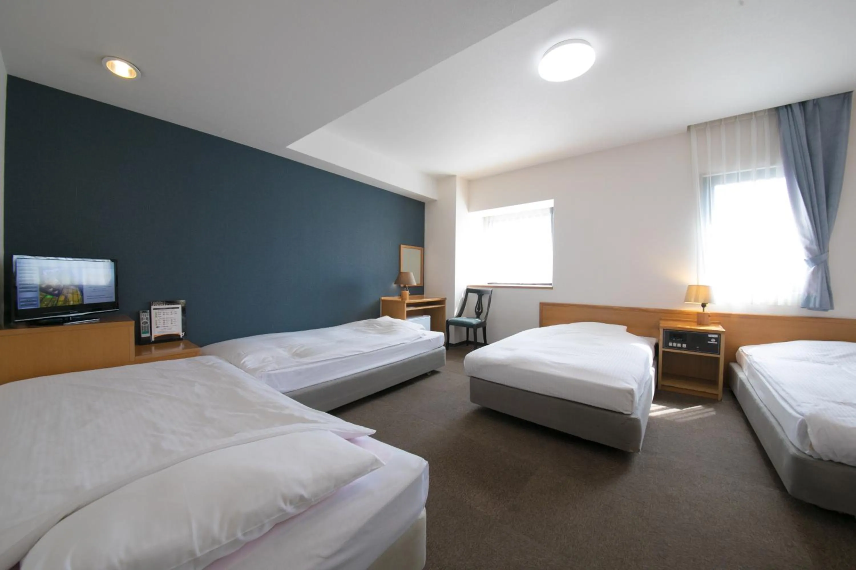 Bed in Heiwadai Hotel 5