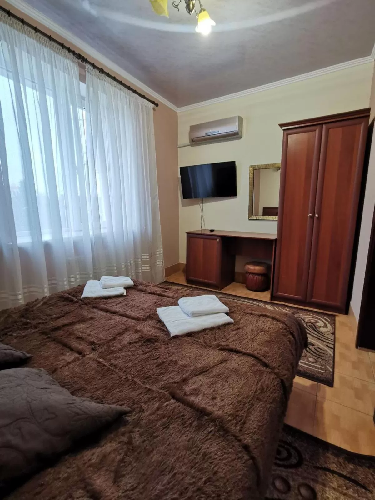 Bed in Monte-Kristo Hotel