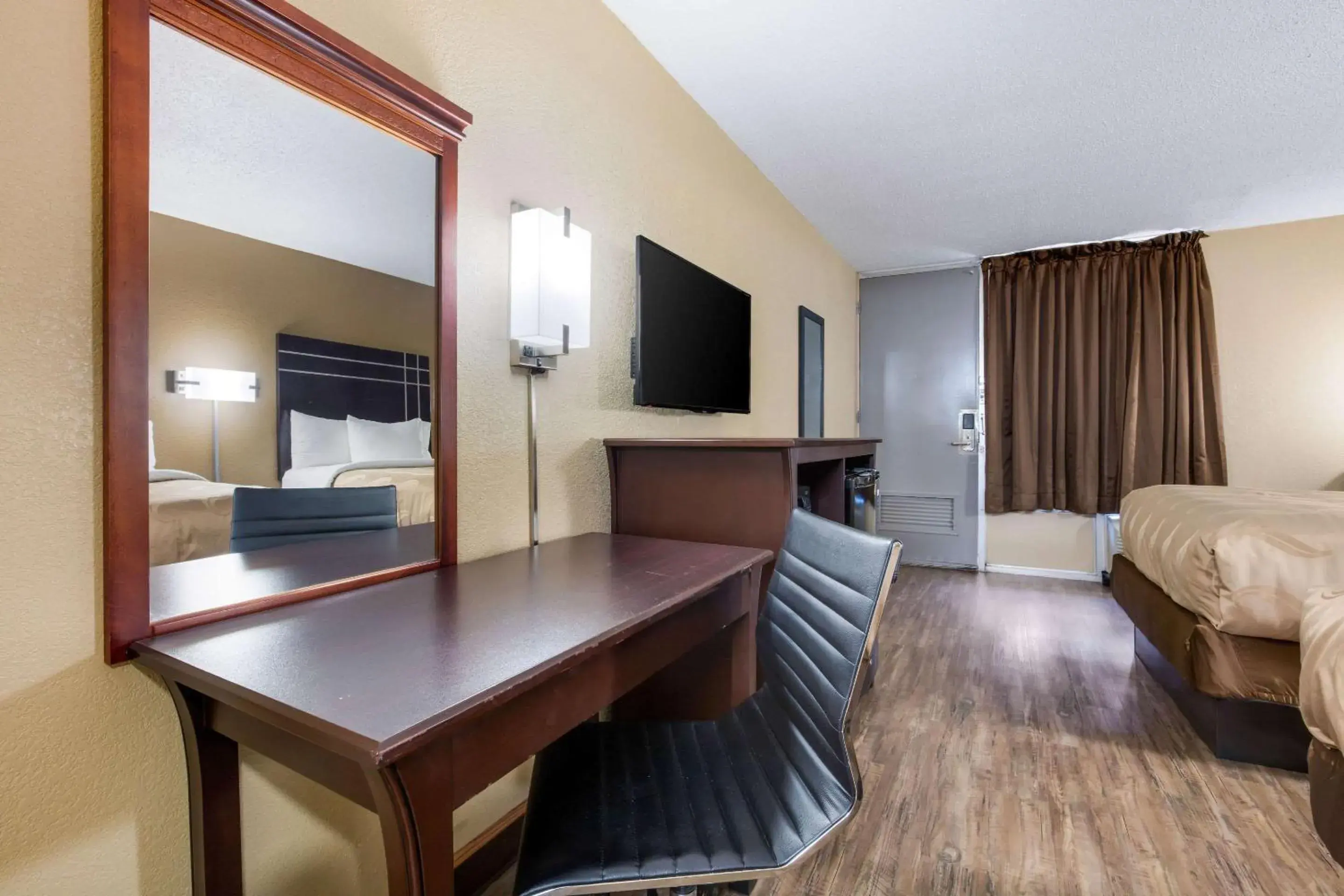 Photo of the whole room, TV/Entertainment Center in Quality Inn