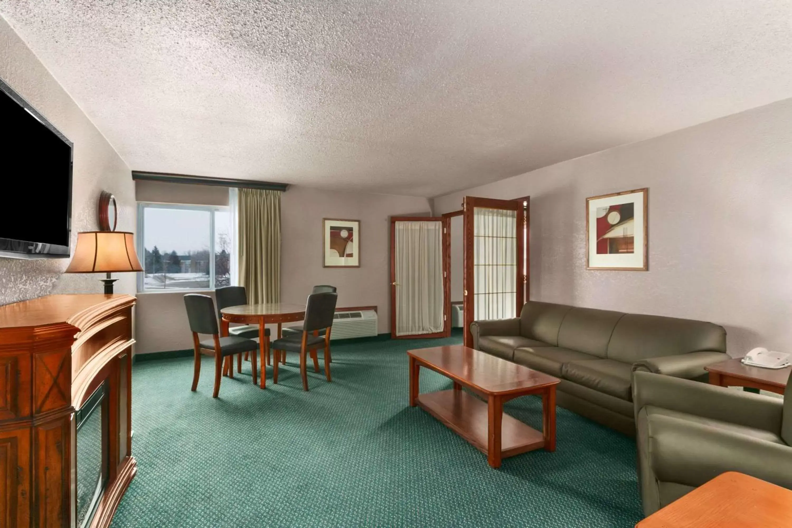 Photo of the whole room, Seating Area in Ramada by Wyndham Bismarck