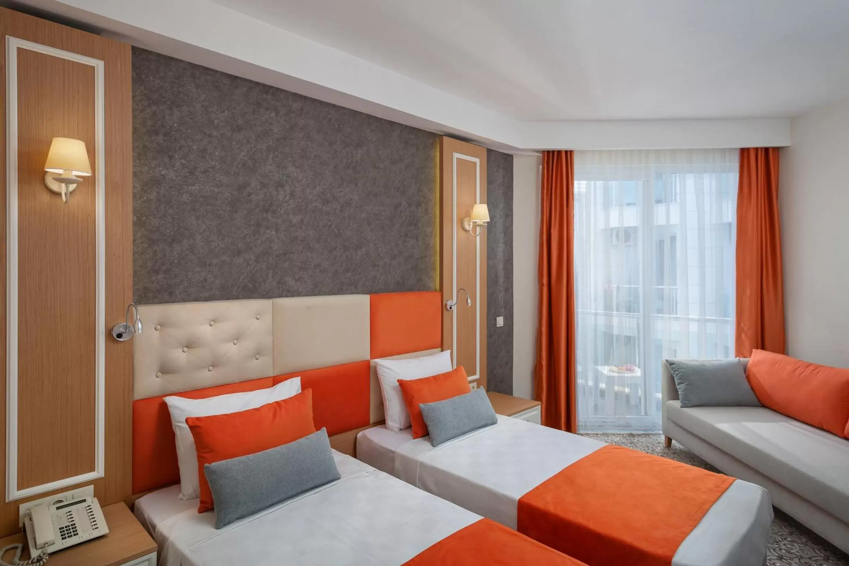 Bed, Seating Area in Golden Orange Hotel